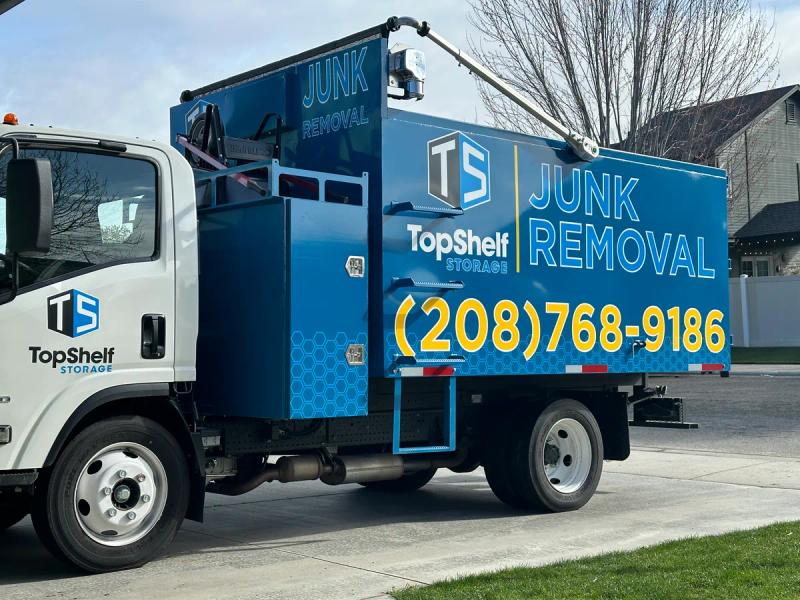 Top Shelf branded junk removal truck ready for service in a Boise Idaho neighborhood