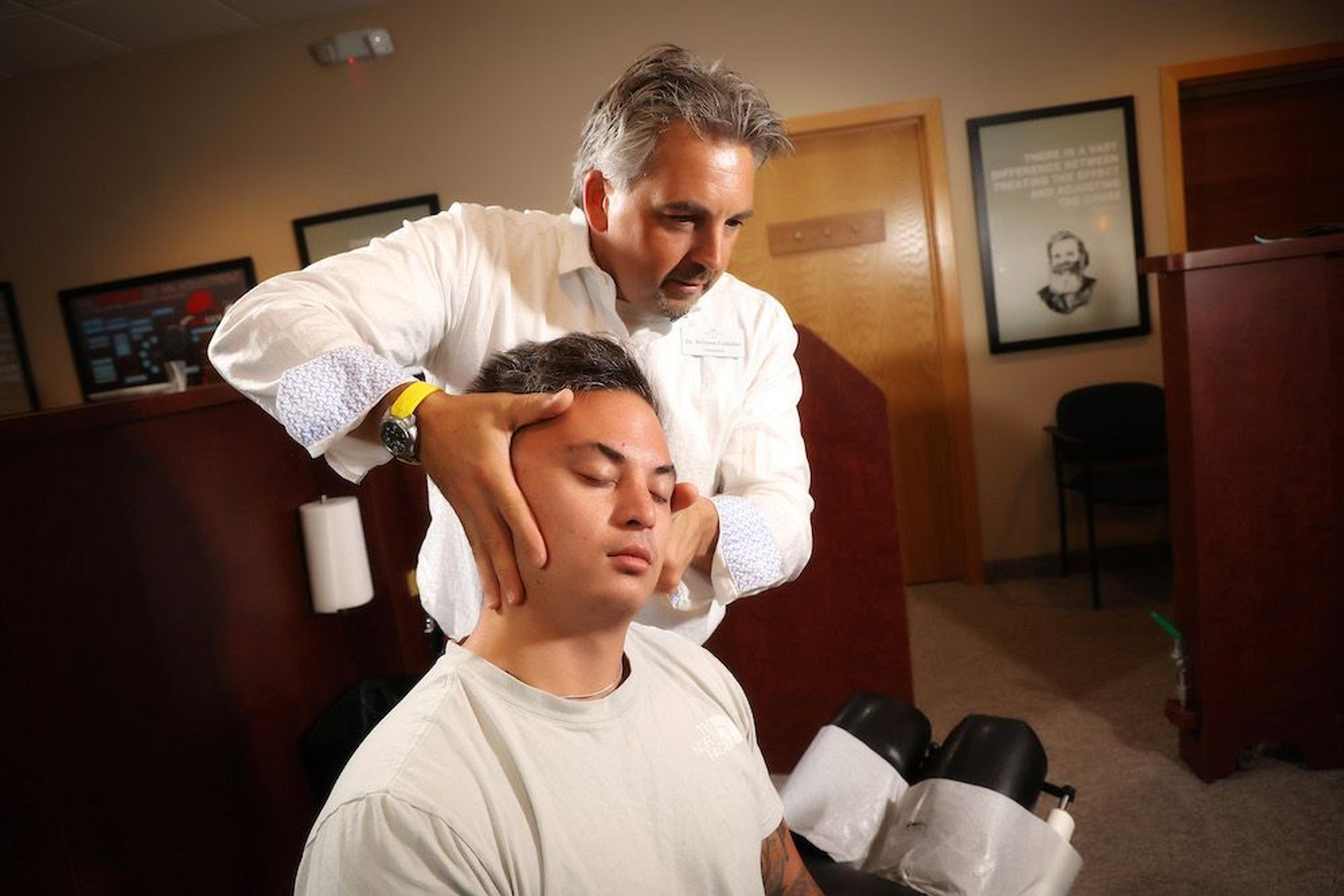 Chiropractor treating neck pain patient at CornerStone Chiropractic in Minot, ND