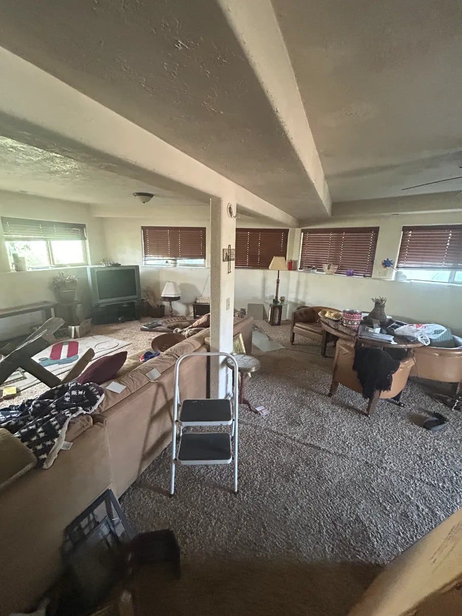 Living room nearly cleared at the end of a cleanout
