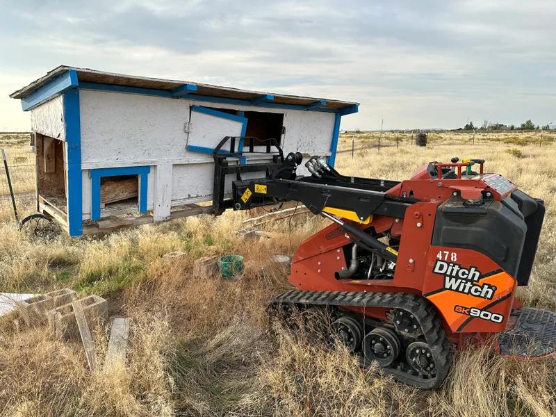 Top Shelf crew removing a chicken coop in Garden City Idaho