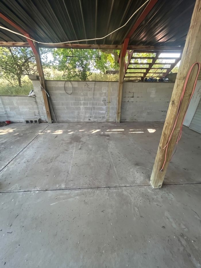After: the same carport, emptied and swept by Man of Steel Junk Removal