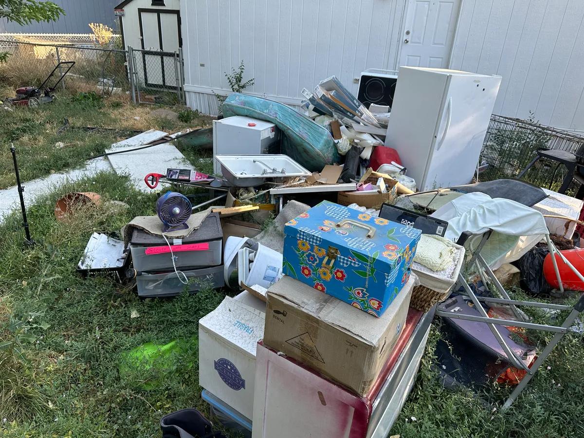 Pile of household junk staged for pickup at a Nampa Idaho property