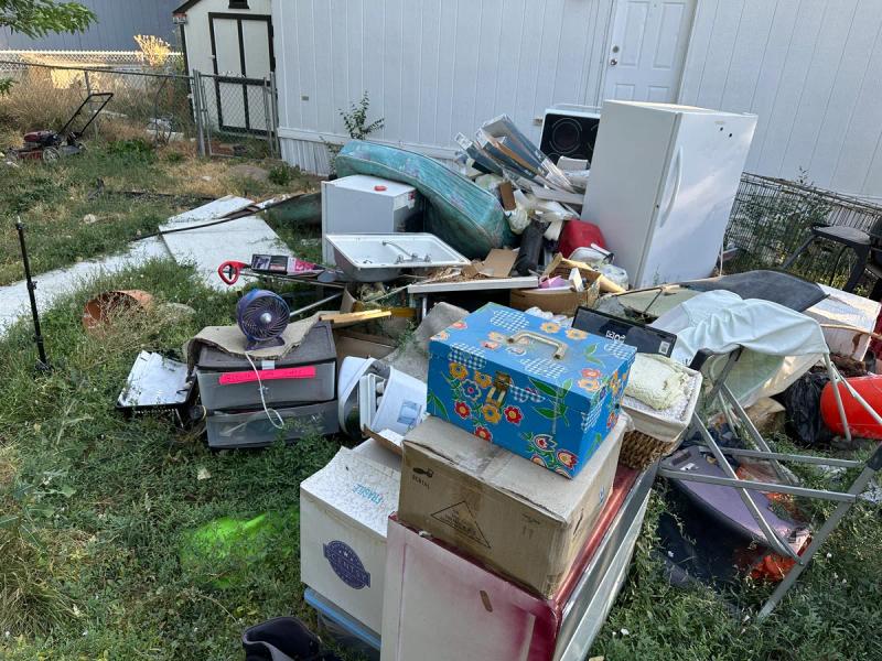 Pile of household junk staged for pickup at a Nampa Idaho property