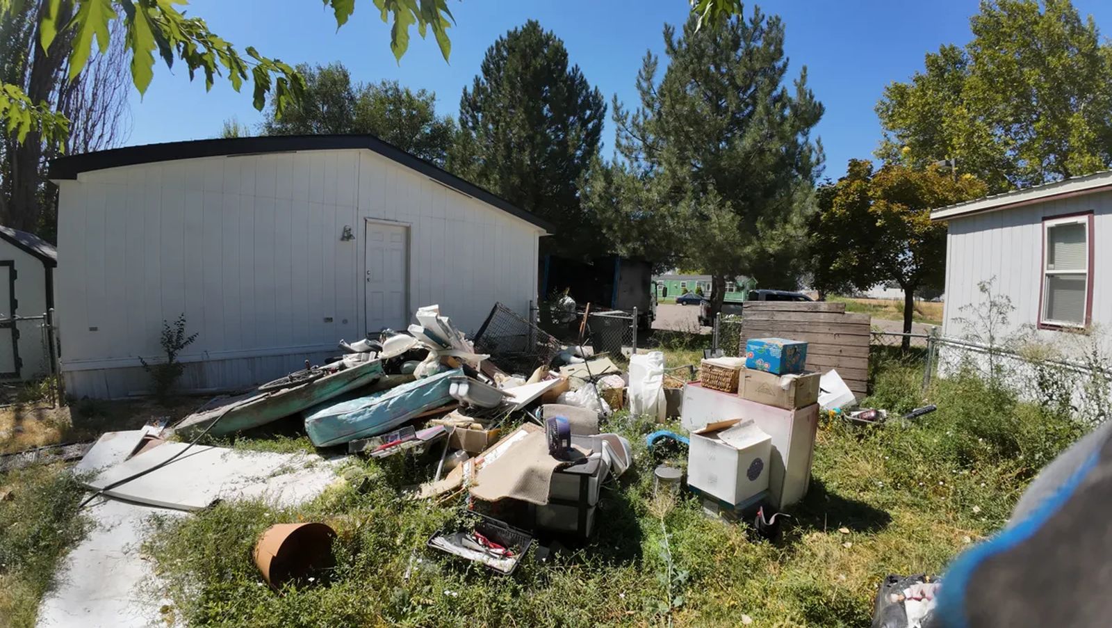 Yard debris during a property cleanout by Top Shelf