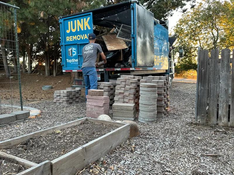 Top Shelf branded truck loaded with pavers during removal in Star Idaho