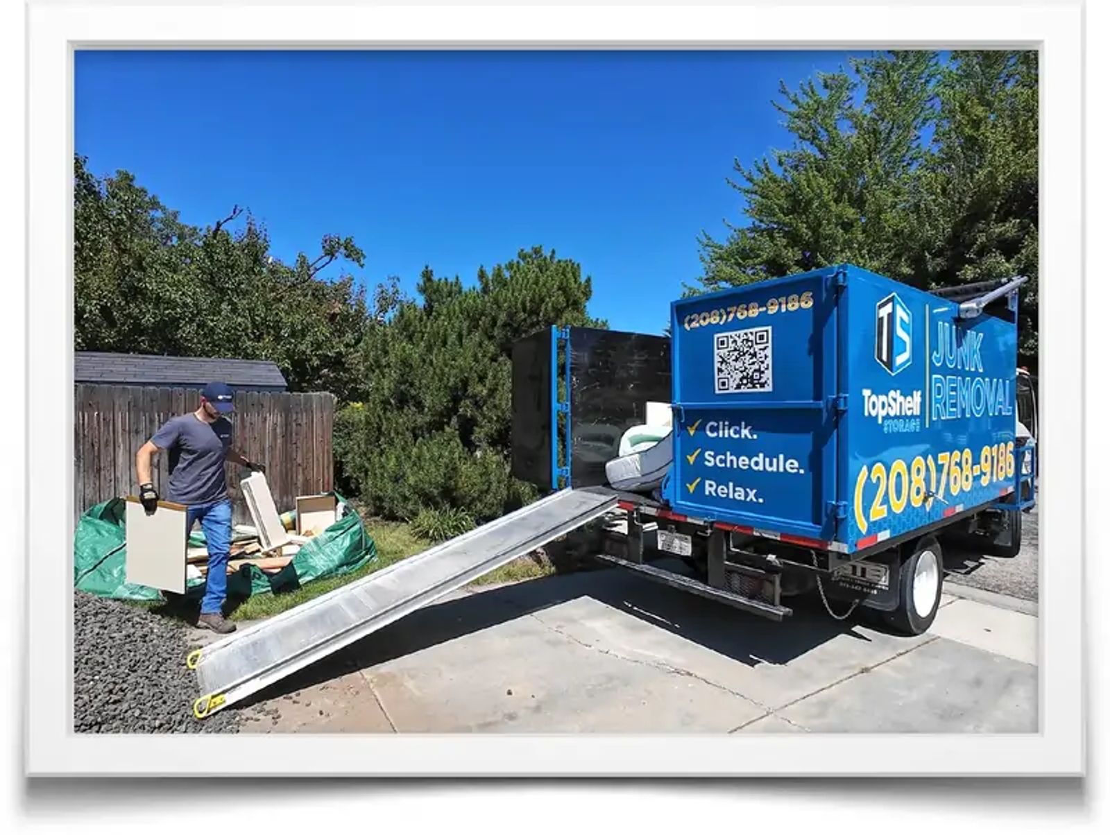 Junk removal crew hauling old furniture and appliances from a Boise home