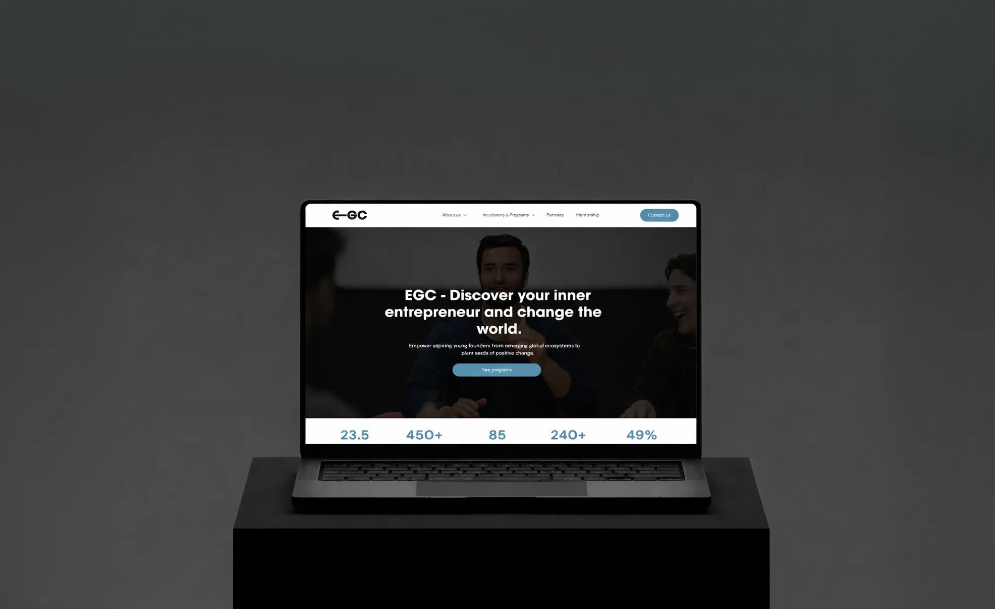 Laptop displaying EGC website homepage with the text Discover your inner entrepreneur and change the world.