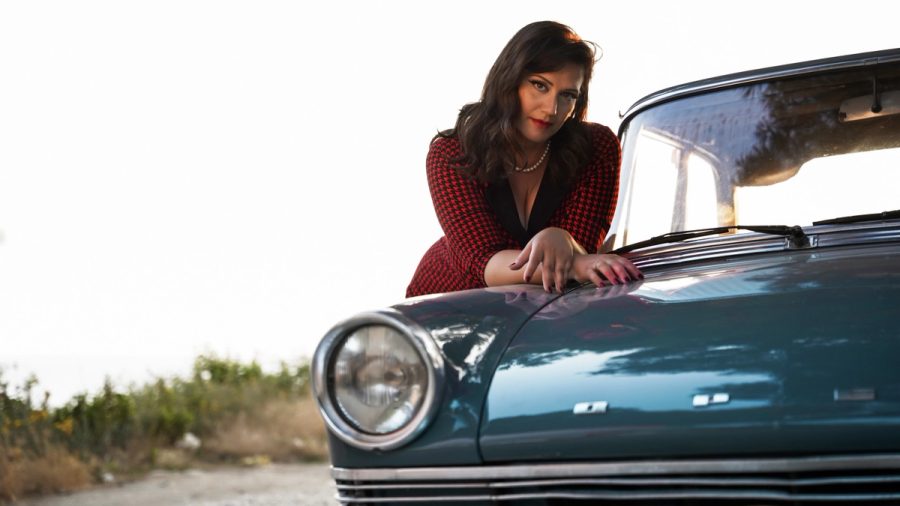 Palimpsest portrait leaning on a blue vintage car.