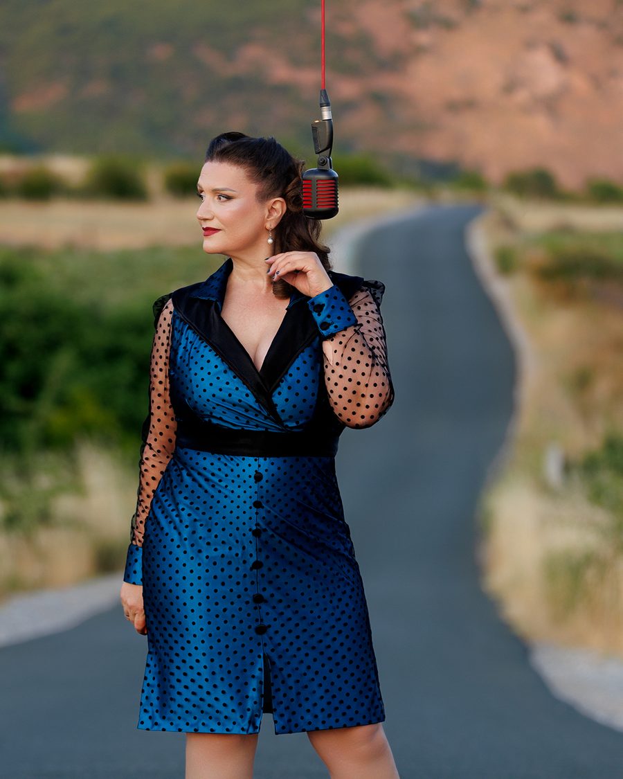 Portrait on a road with suspended microphone.