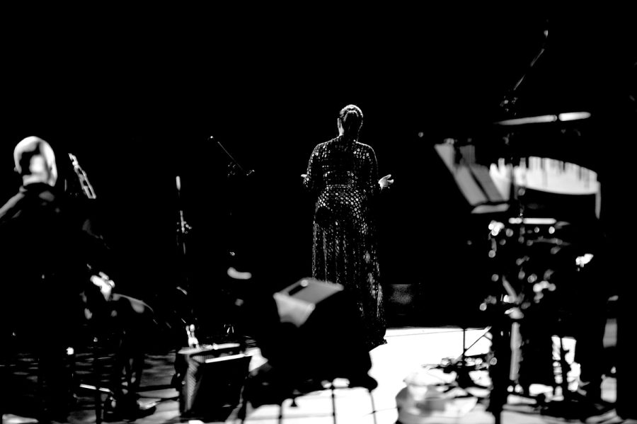Black-and-white band photograph from behind the performers.