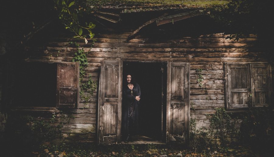 Portrait at a wooden building