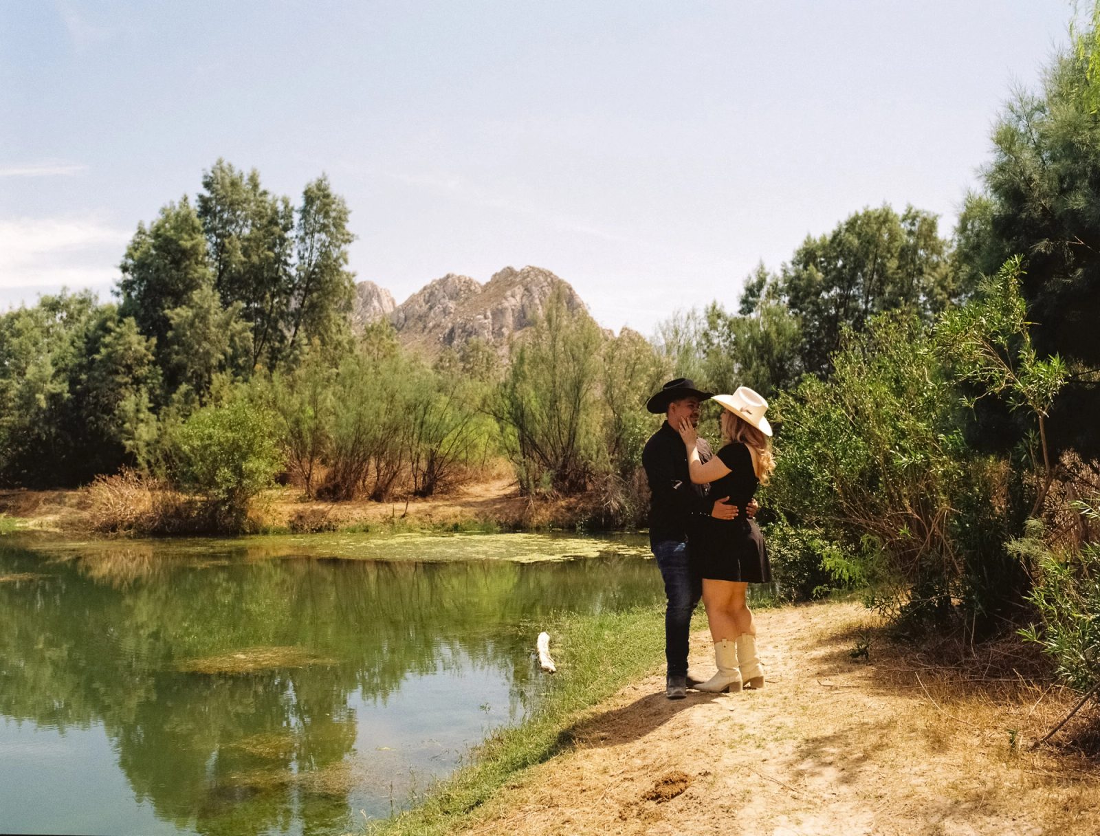 Western styled couple by the lake and mountains of Mina