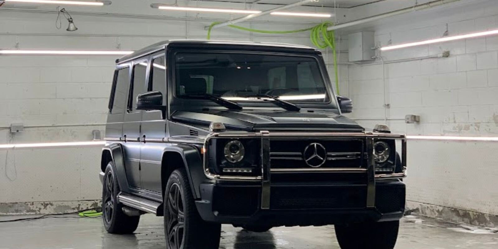 Matte black Mercedes G-Class in the studio bay