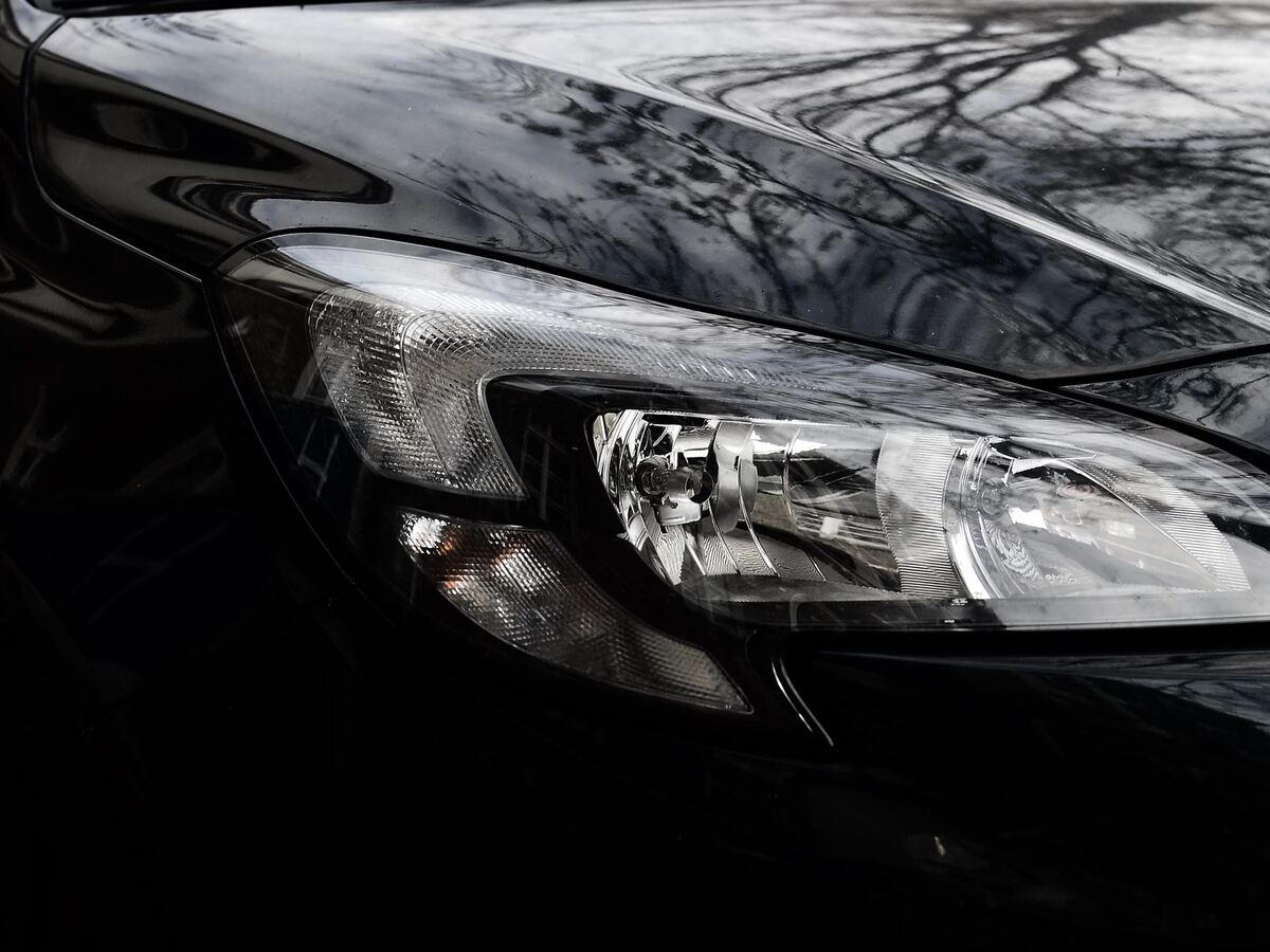 Glossy black hood and headlight with protective film applied