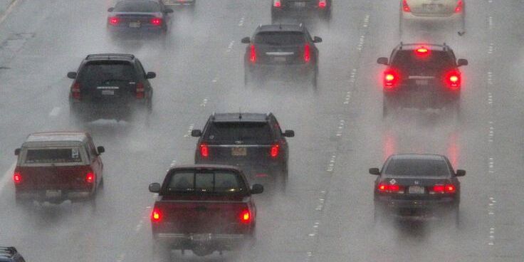 Cars driving on a highway in rain