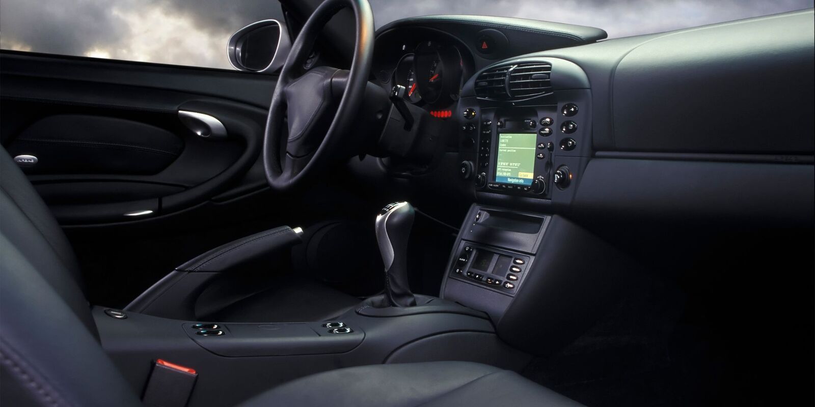 Dark leather interior and dashboard of a sports car