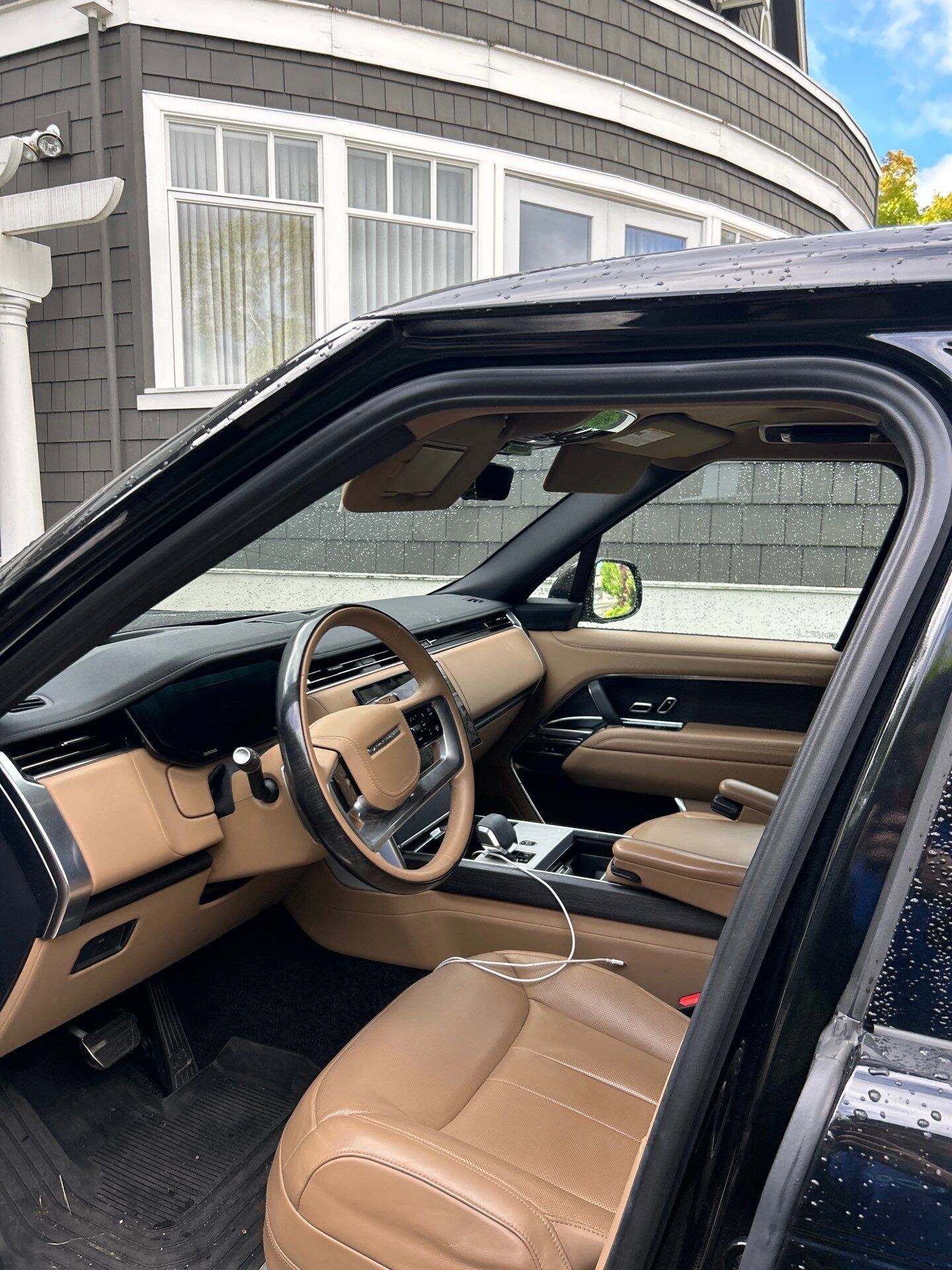 Range Rover tan leather dashboard and steering wheel, cleaned
