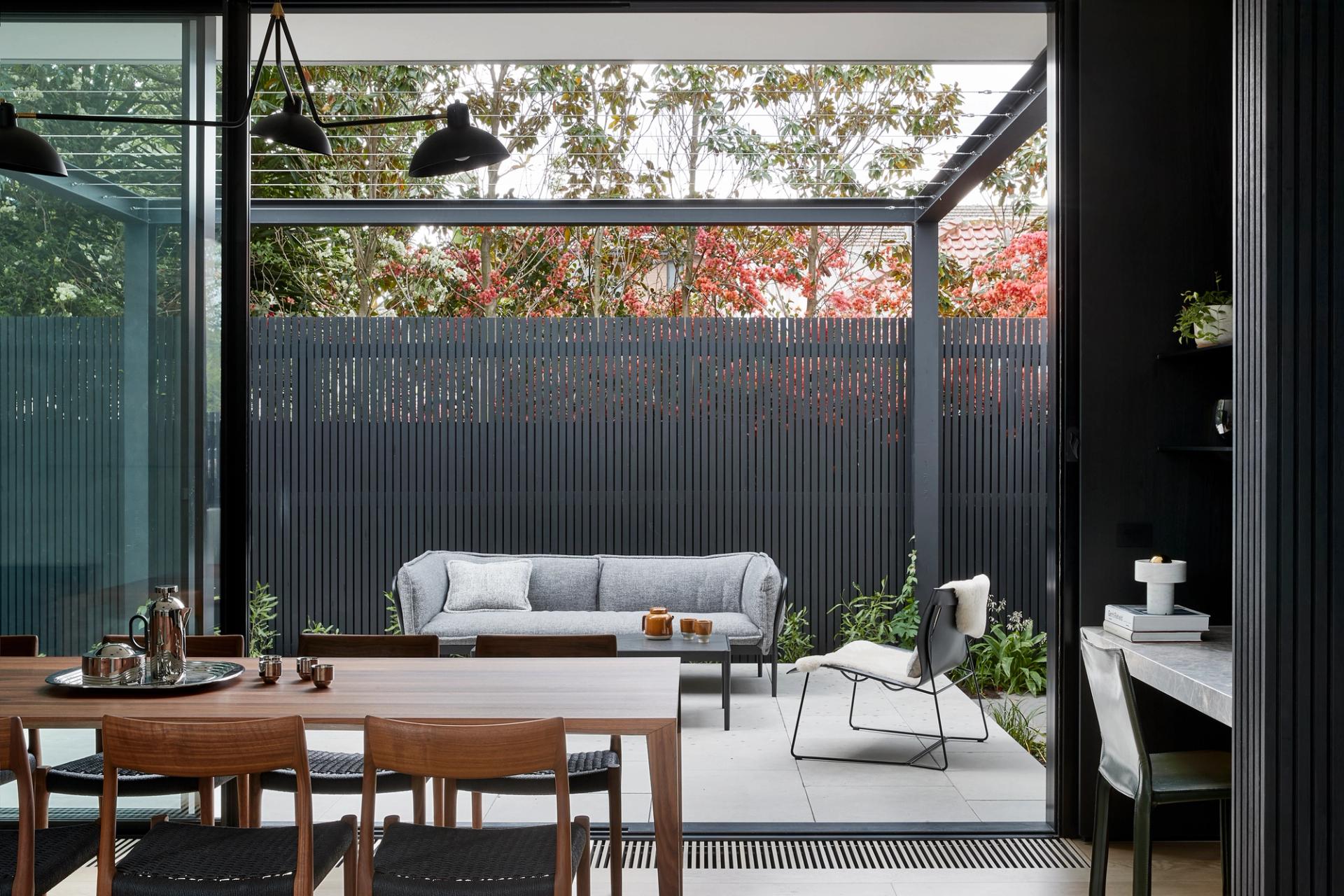 The dining area and sun-drenched terrace are seamlessly connected.