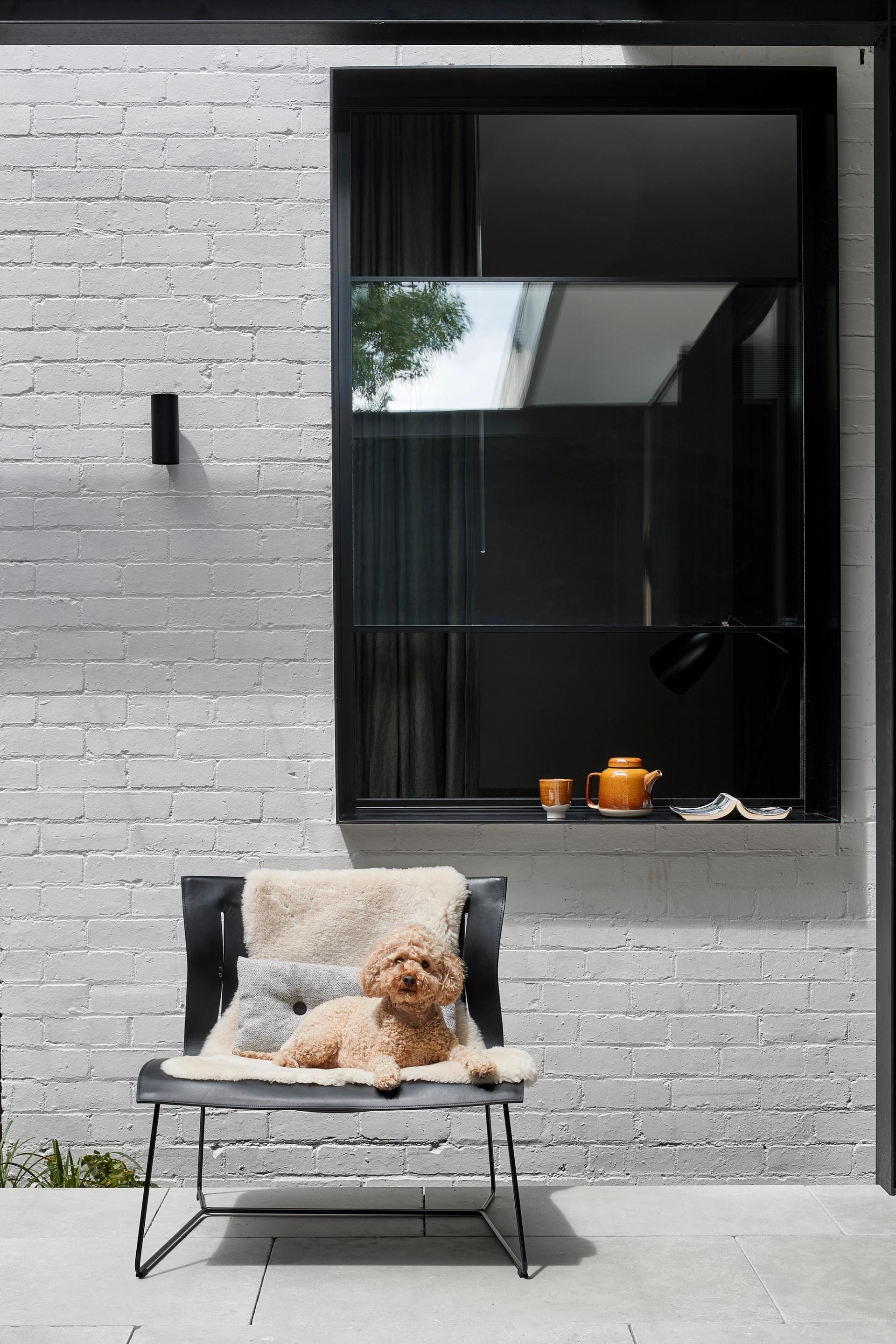 Thye sunny outdoor terrace offers moments of tranquility for the residents of Hidden House.