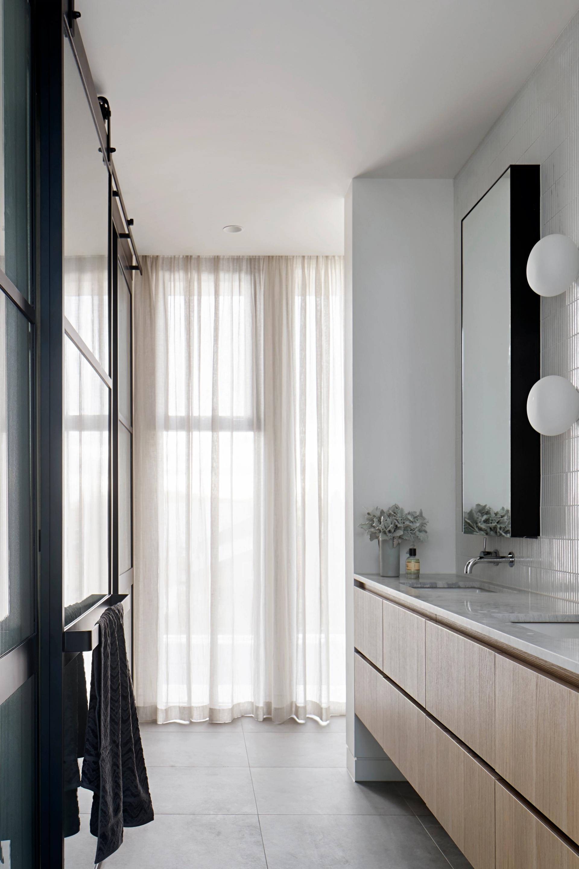 The main bedroom suite is upstairs, with a void between up and down ensuring the parents are connected to family life.