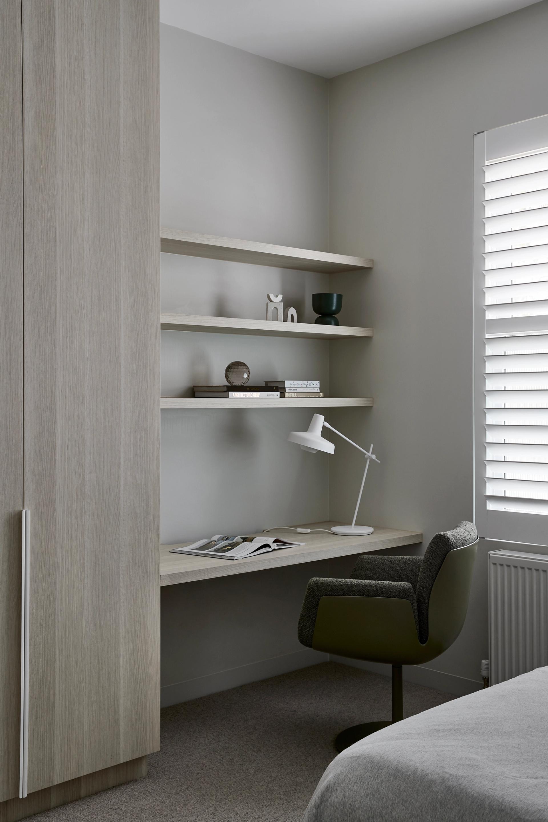A monochromatic palette unifies the entire home, including the study areas.