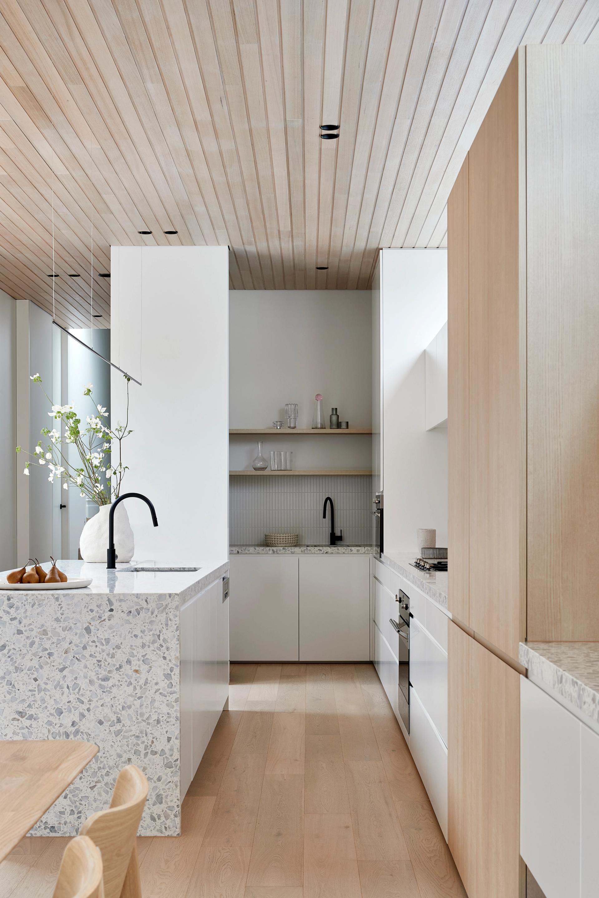 Crisp detailing and practical joinery are a feature of the kitchen of this Clifton Hill home.