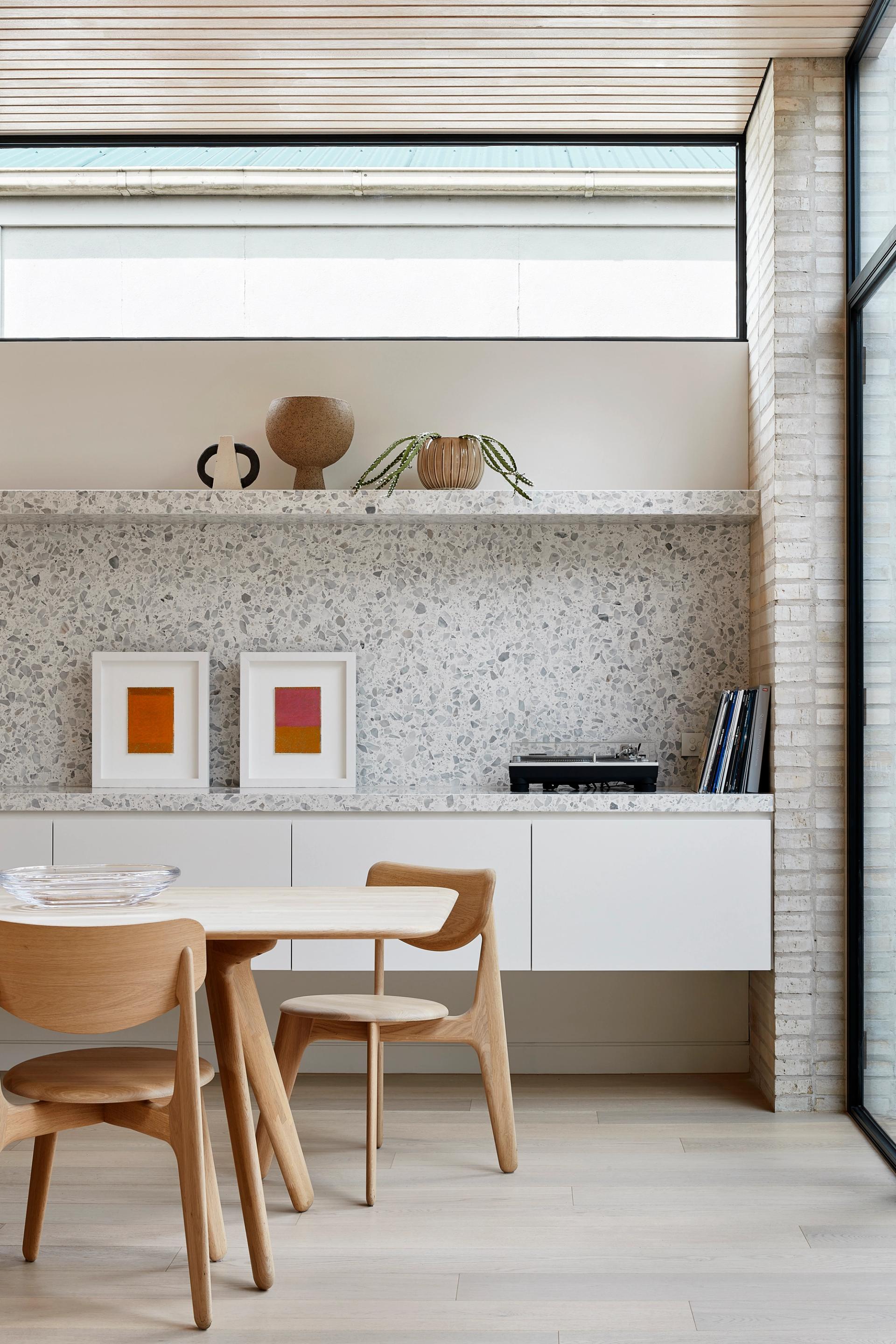 The brick and glass extension of the Clifton Hill Courtyard House connects with the rear garden.