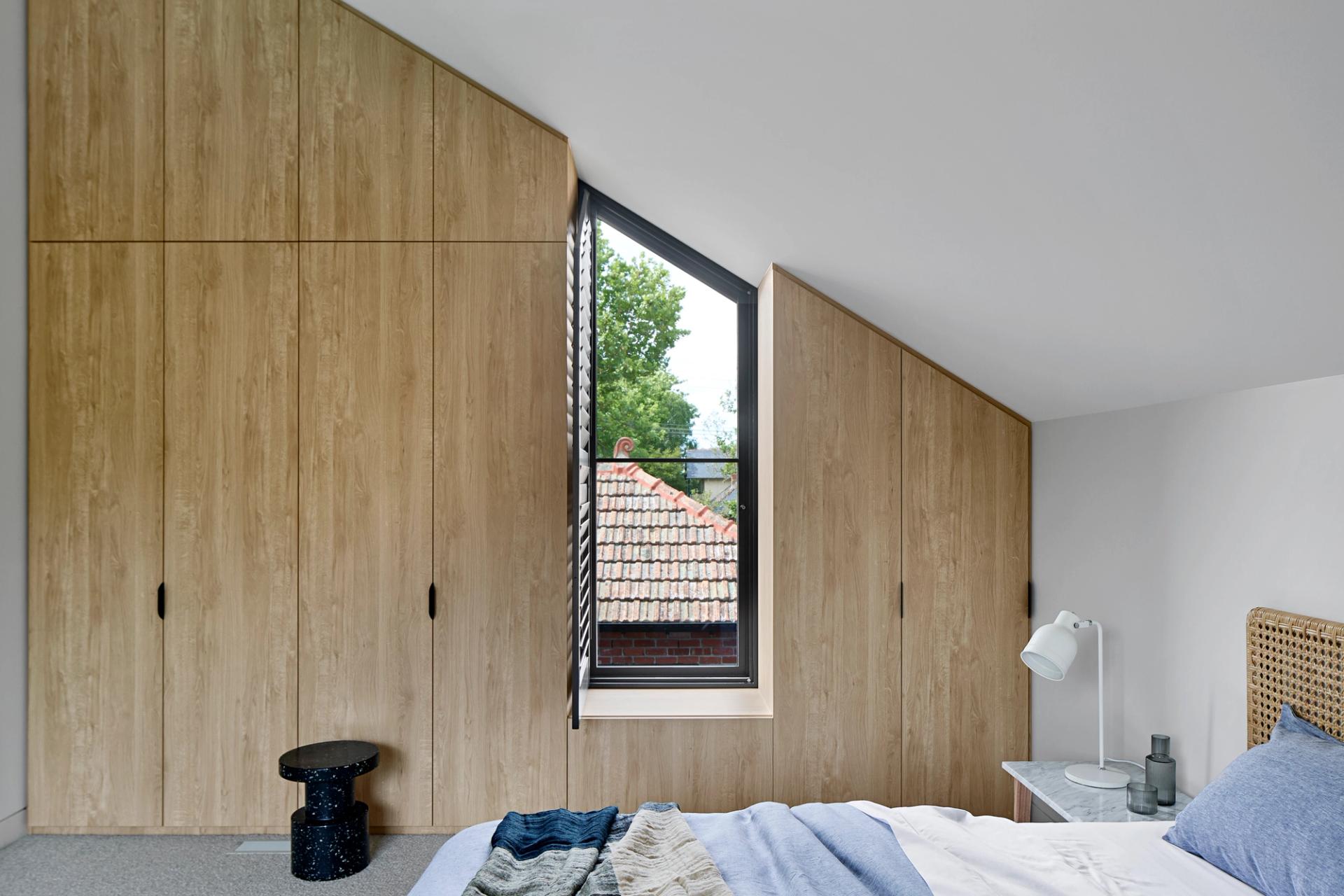 Timber-framed window seats provide ideal study spots for teenagers.