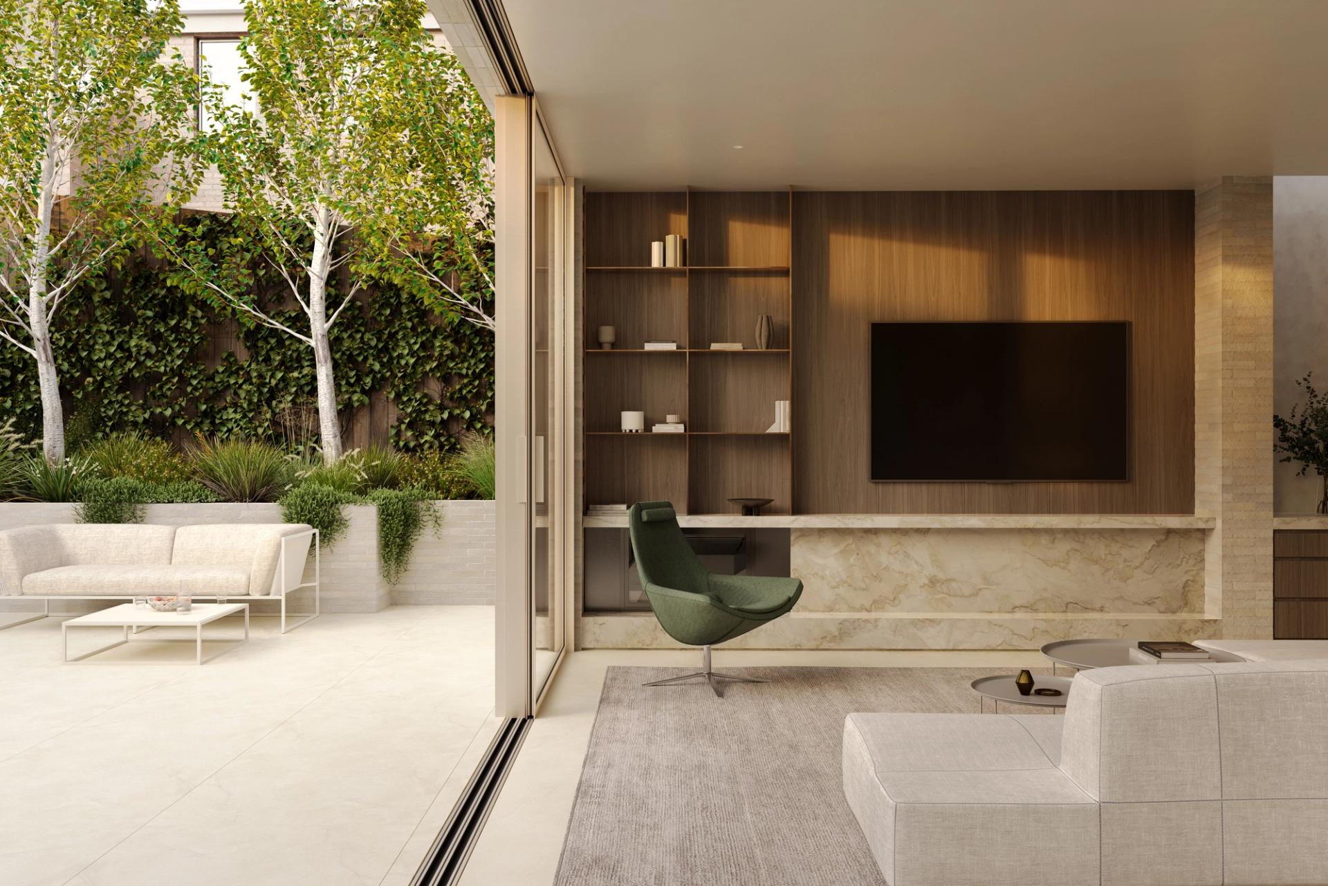 Open-plan living features expansive glazing that opens out onto the landscaped courtyard.