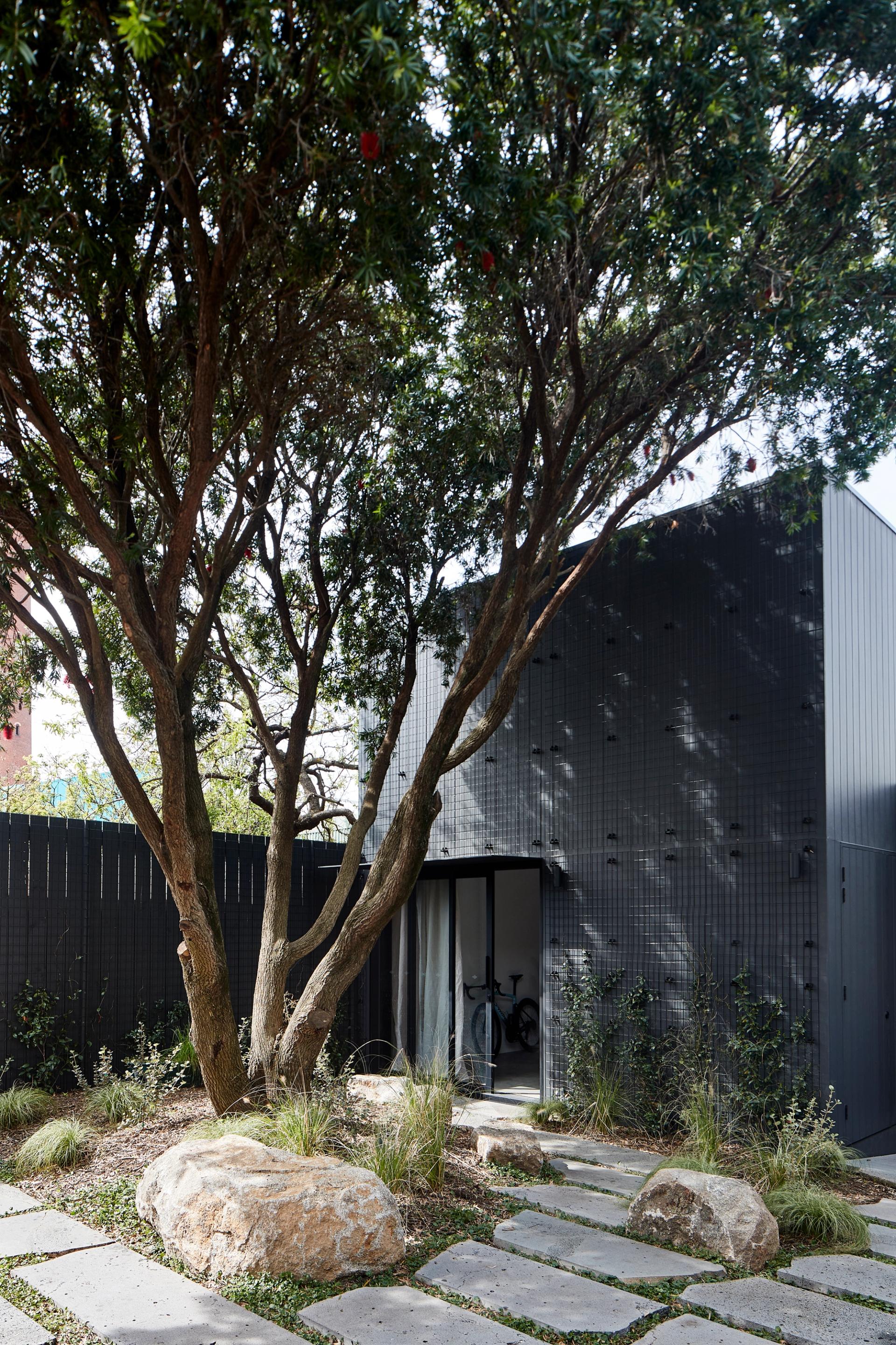 A garden studio acts as a teenage retreat and guest quarters.