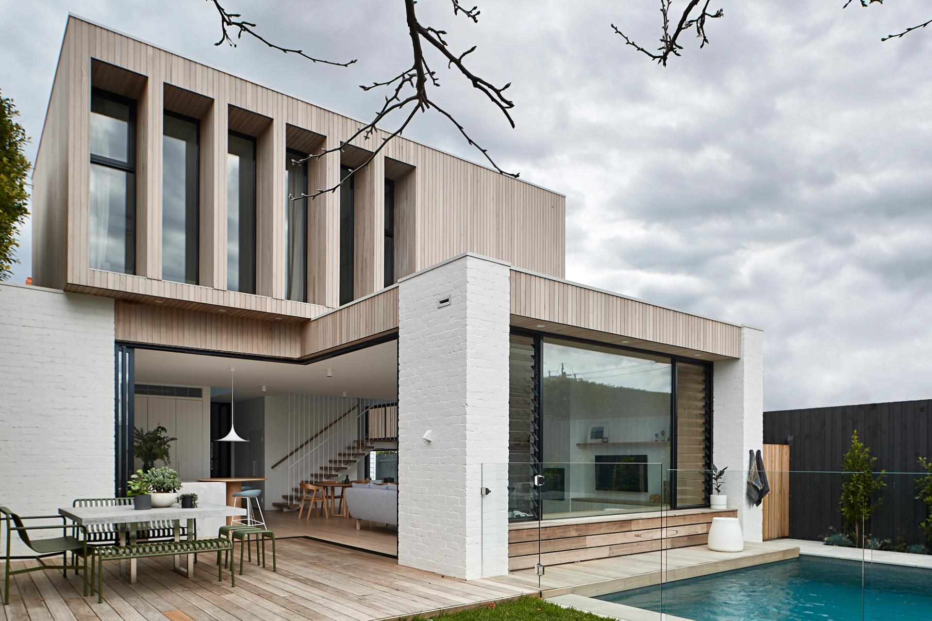 The pool and the living space are visibly connected as part of the design.
