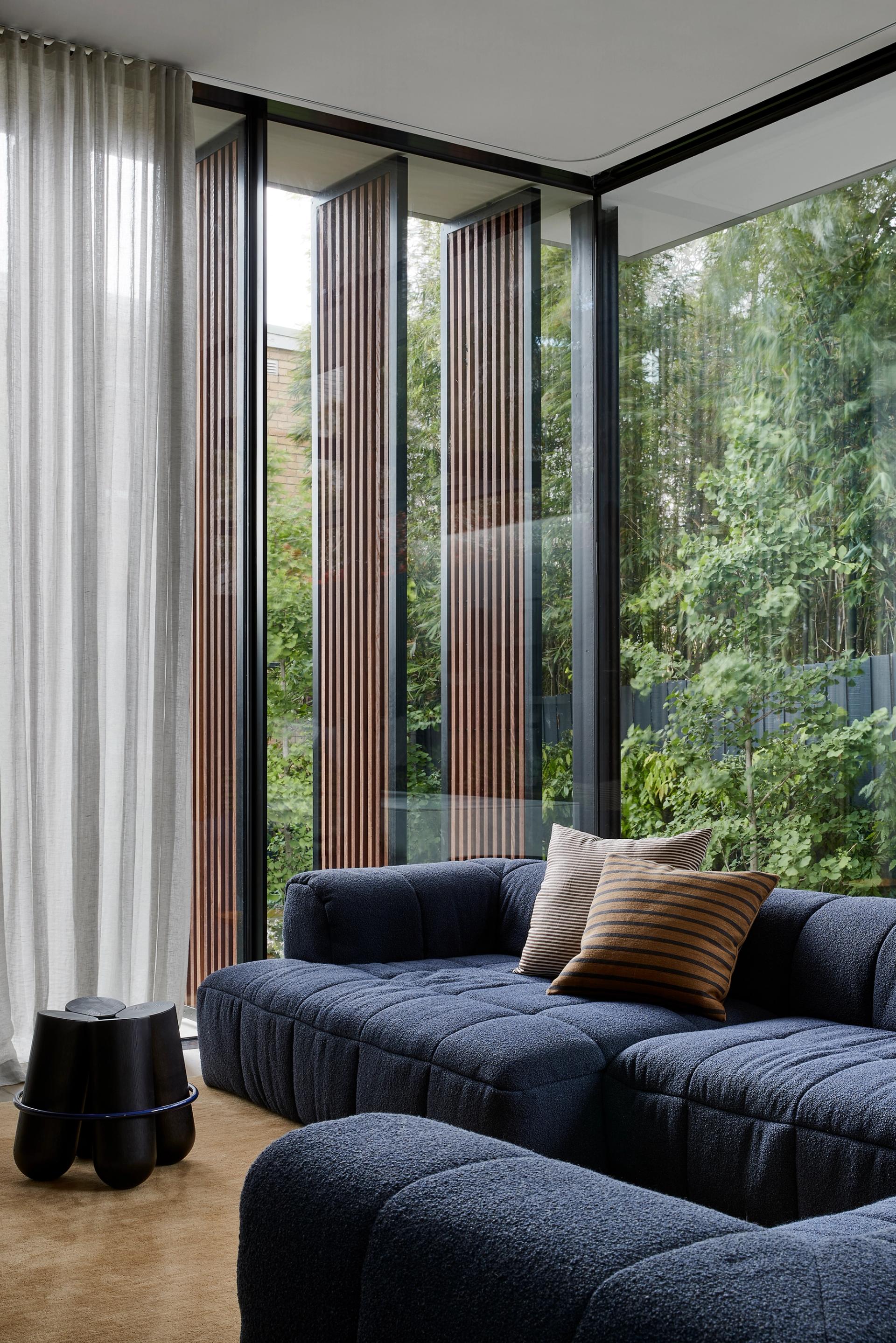 The full-height screens give the residents control over the nature of their home.