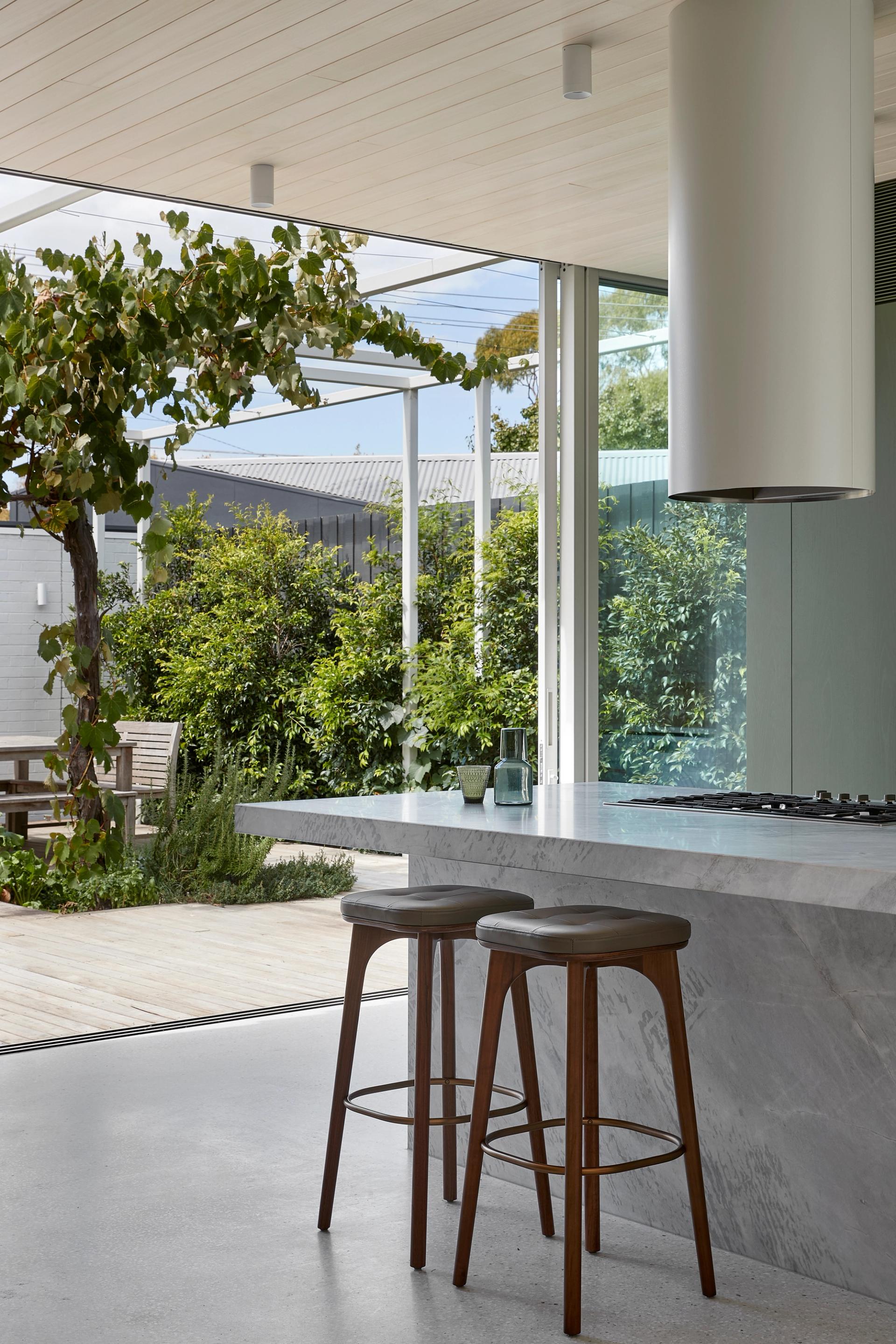 The single-level rear addition encompasses kitchen, living and dining spaces without encroaching on the outdoor space.