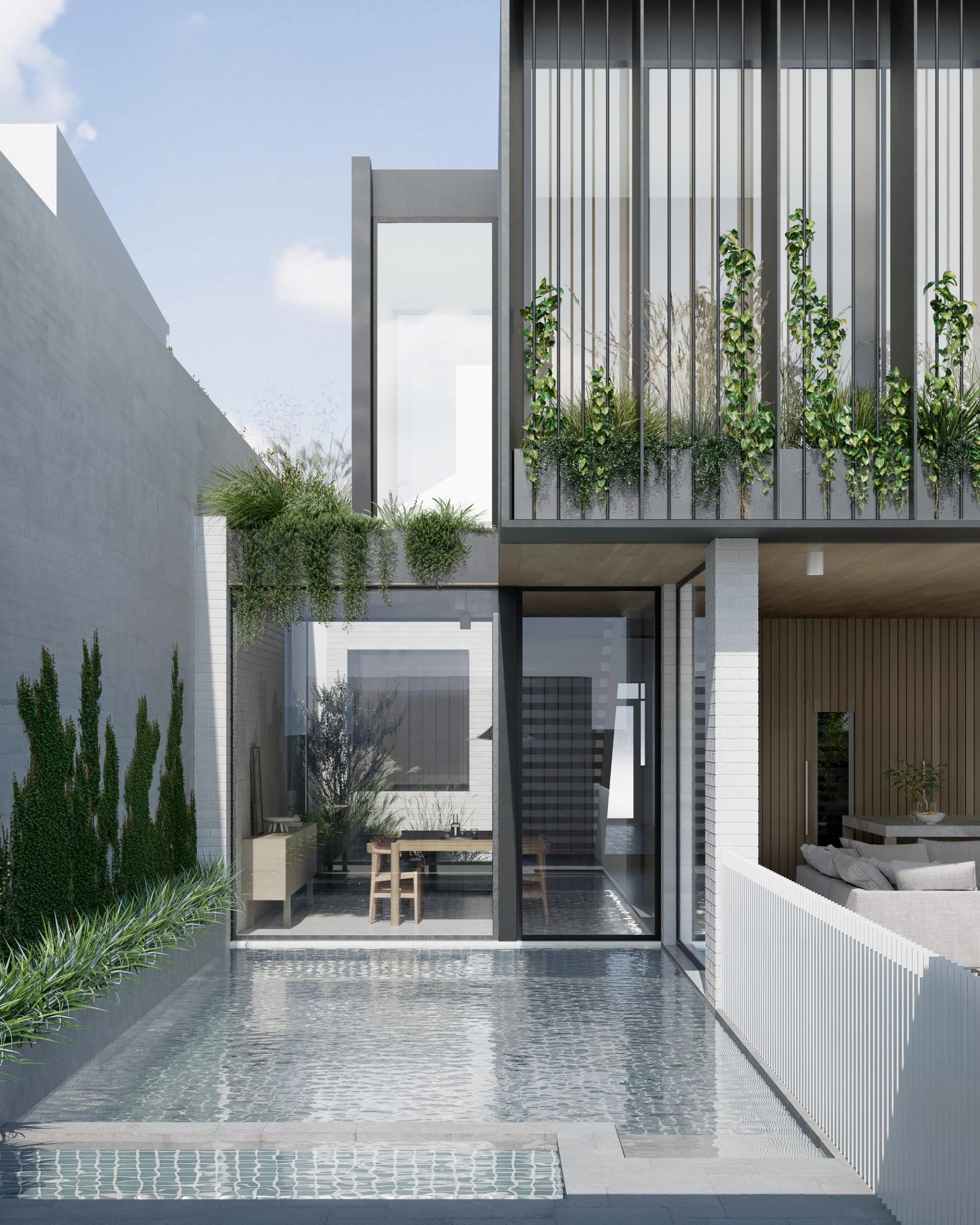 The upper level’s custom steel-bladed façade is ensconced in greenery.