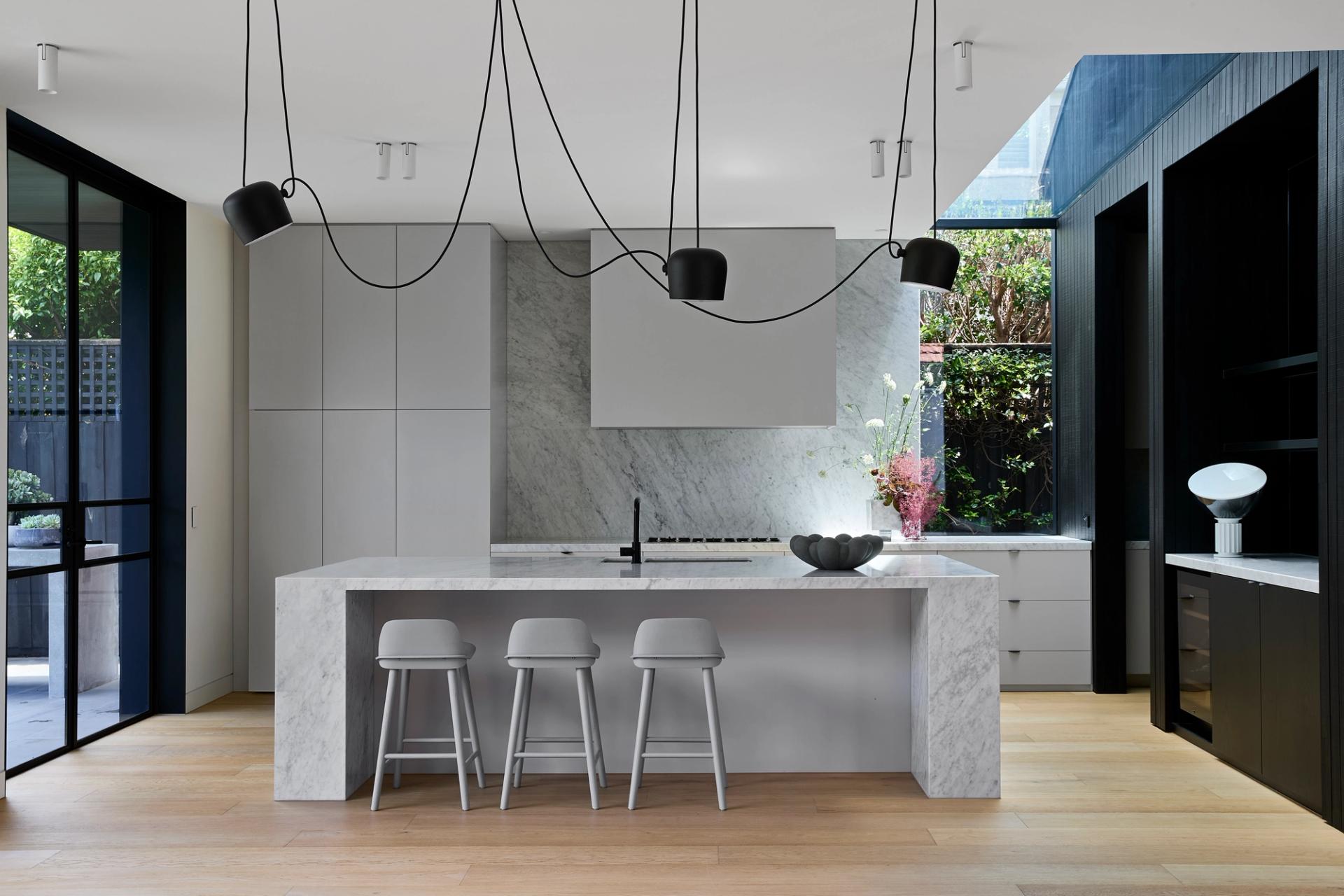 The kitchen's linear skylight celebrates the junction of existing and new roof forms.