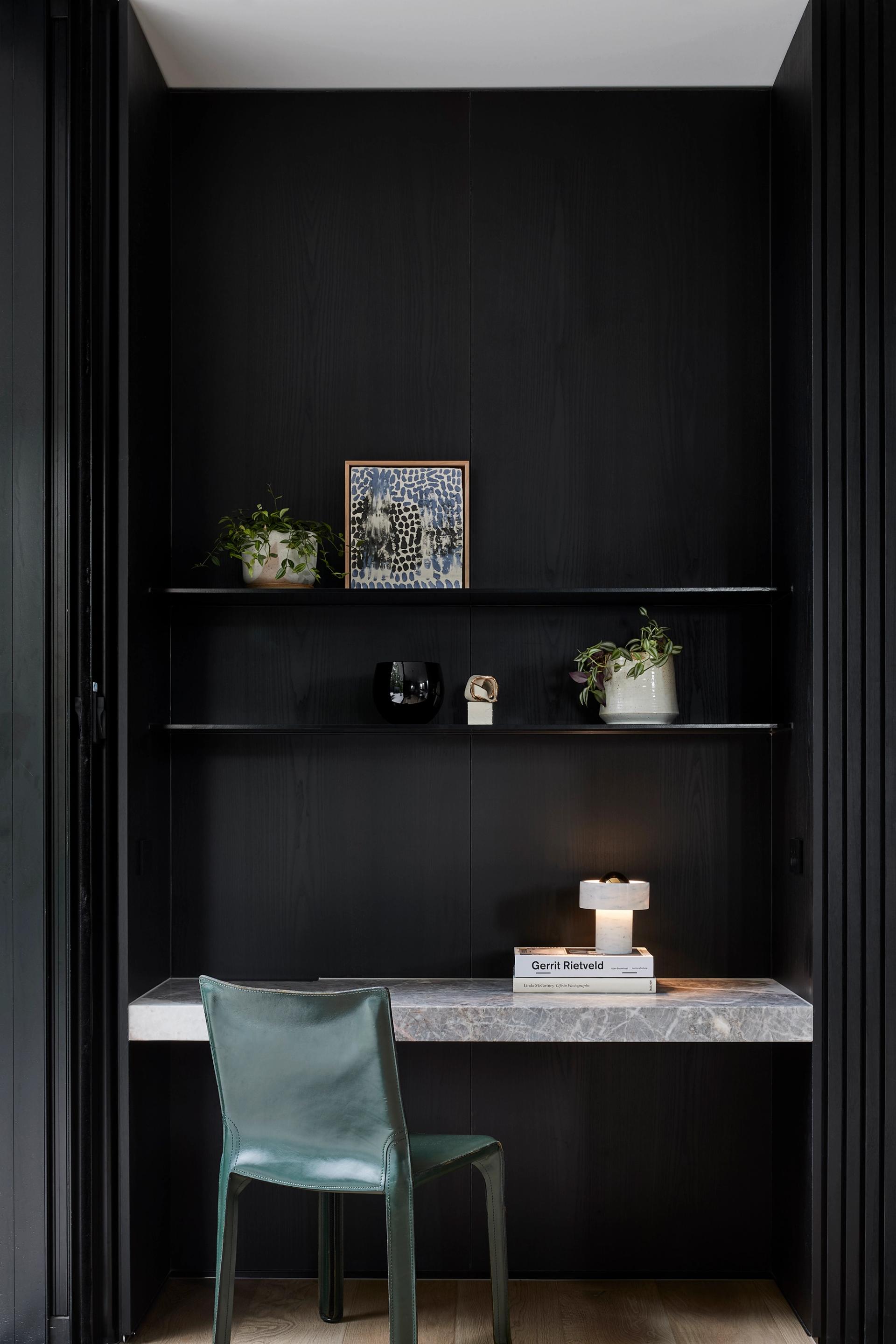 Highly veined marble, sleek black timber veneer and robust black steel create a resilient, timeless appeal.