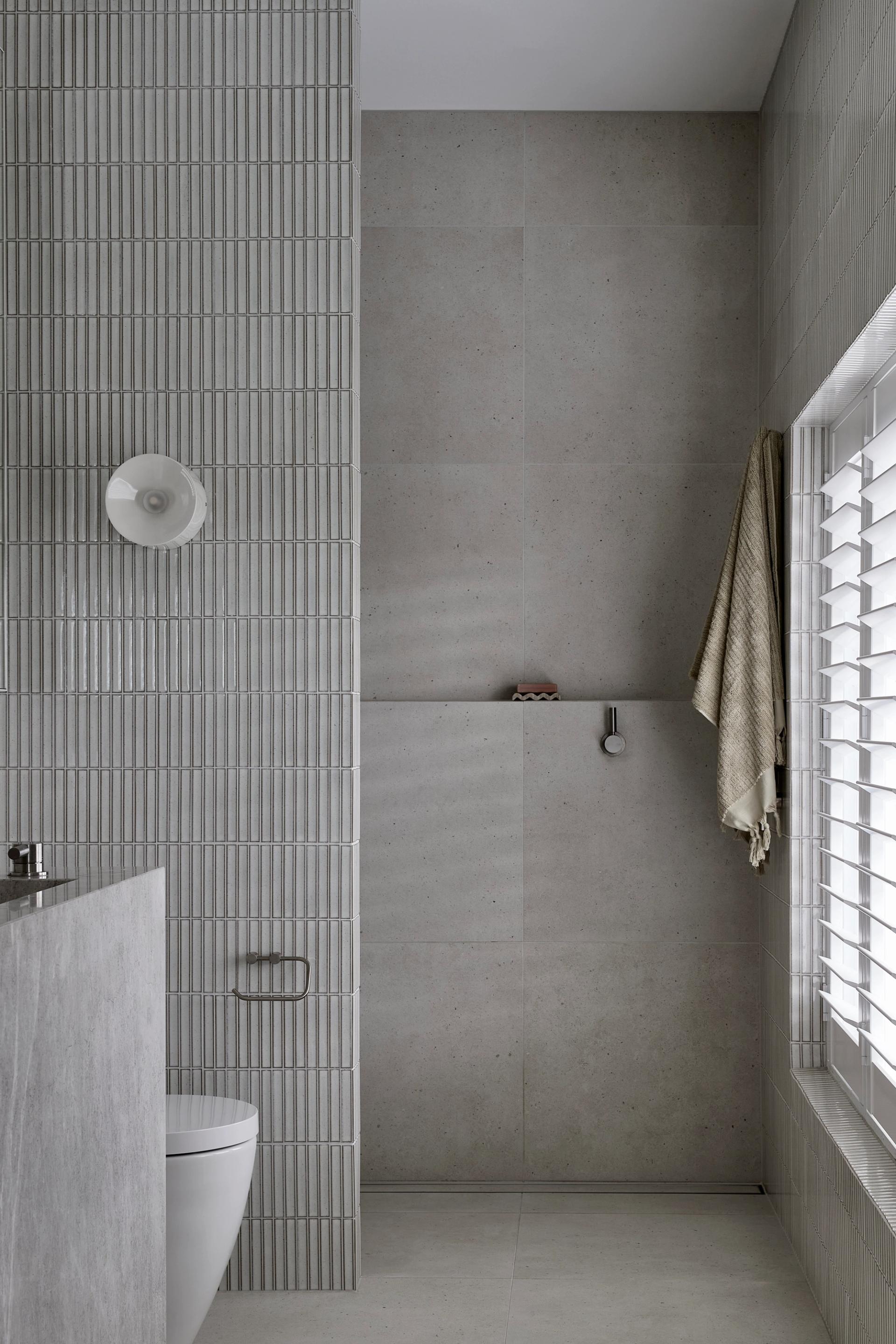 The upstairs bathrooms boast premium finishes and materials.