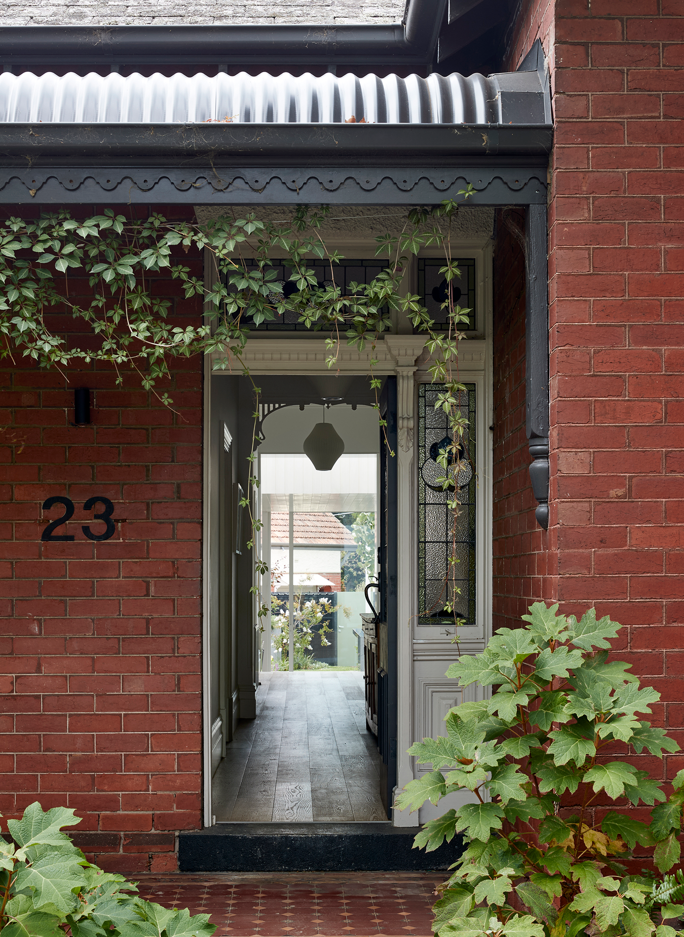 The double-fronted Edwardian has been updated with a rear addition that preserves the home's outdoor space.