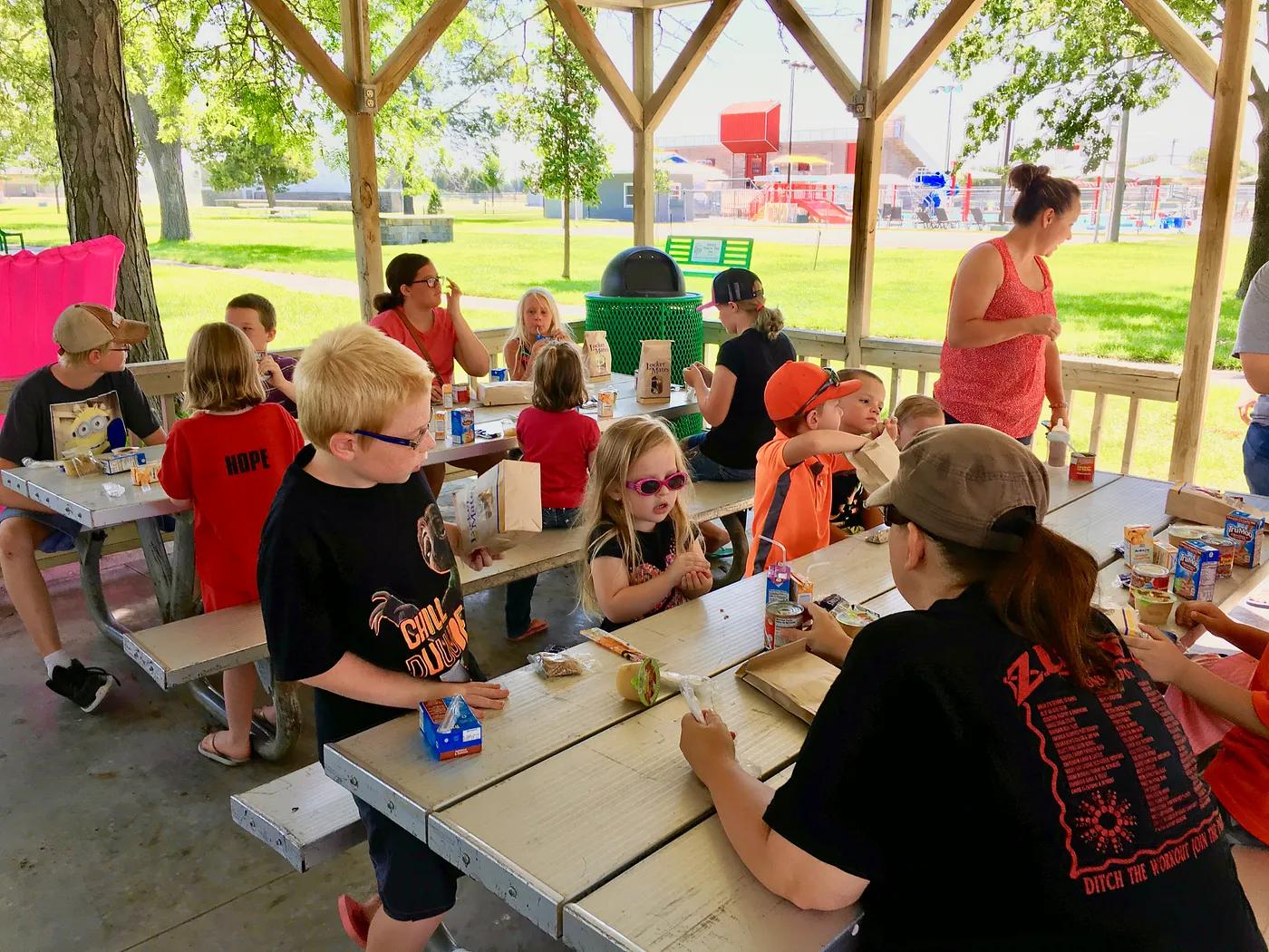 children enjoying a Summer Food Service Program meal