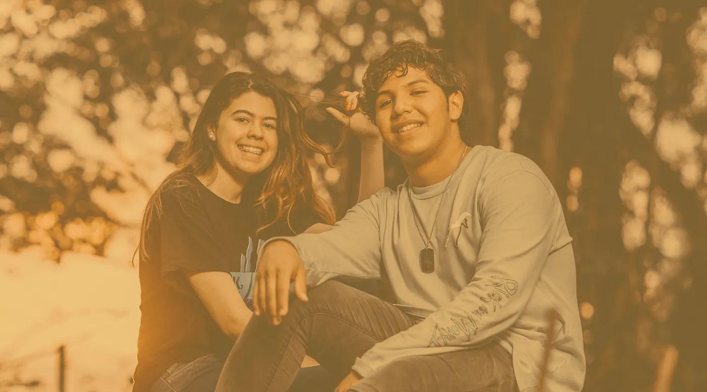 two young people sitting together