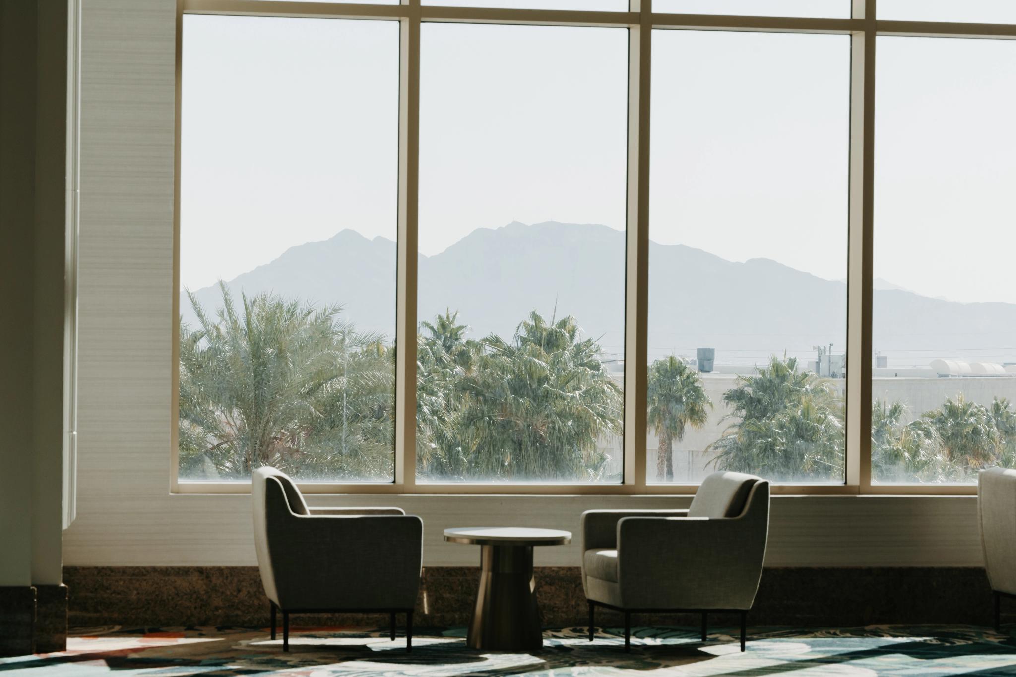 Two chairs beside a window
