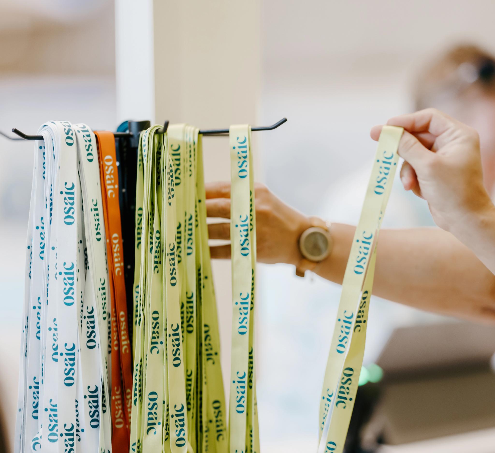 A Financial Professional chooses an Osaic lanyard