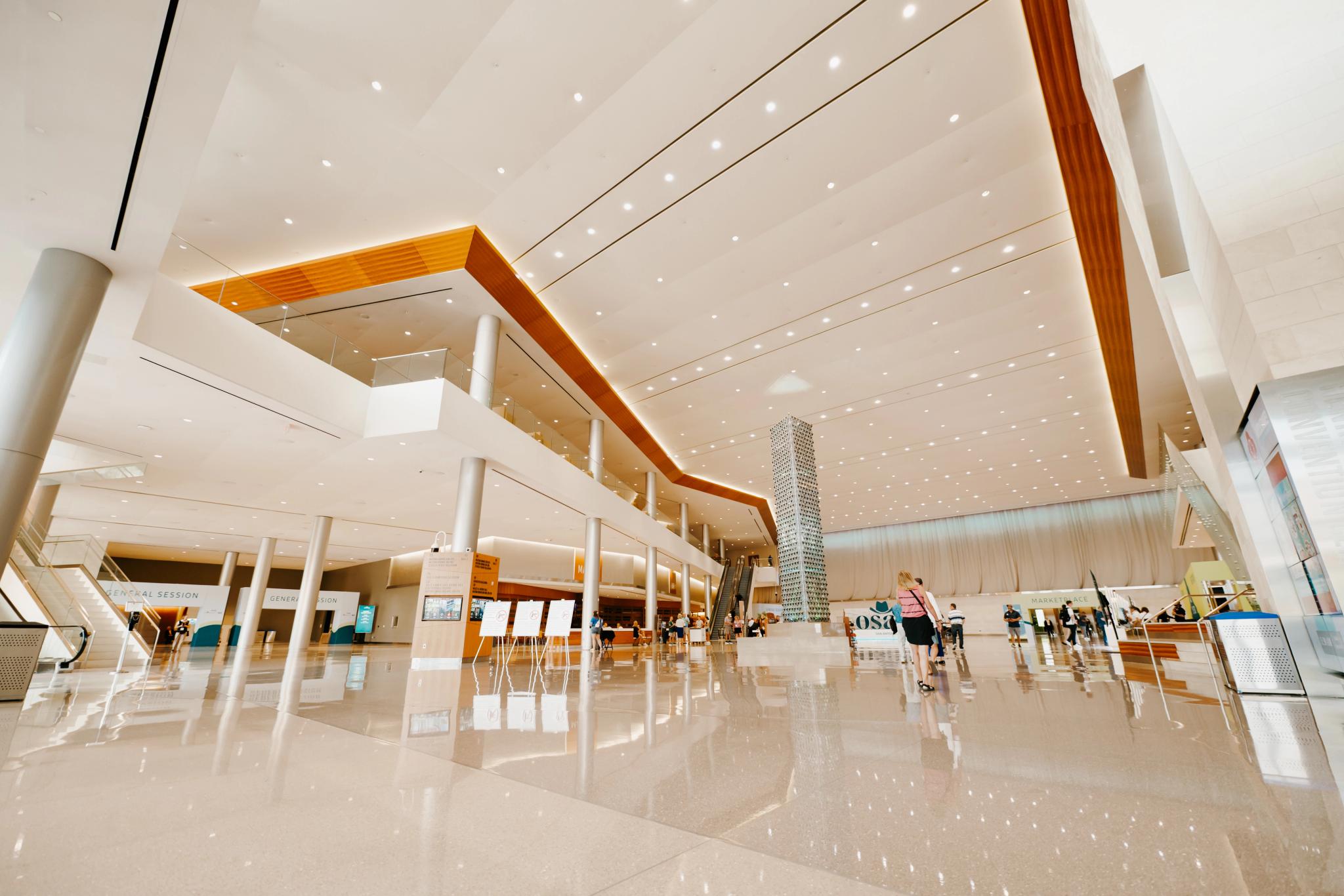 Advisors meet in a large, bright conference space