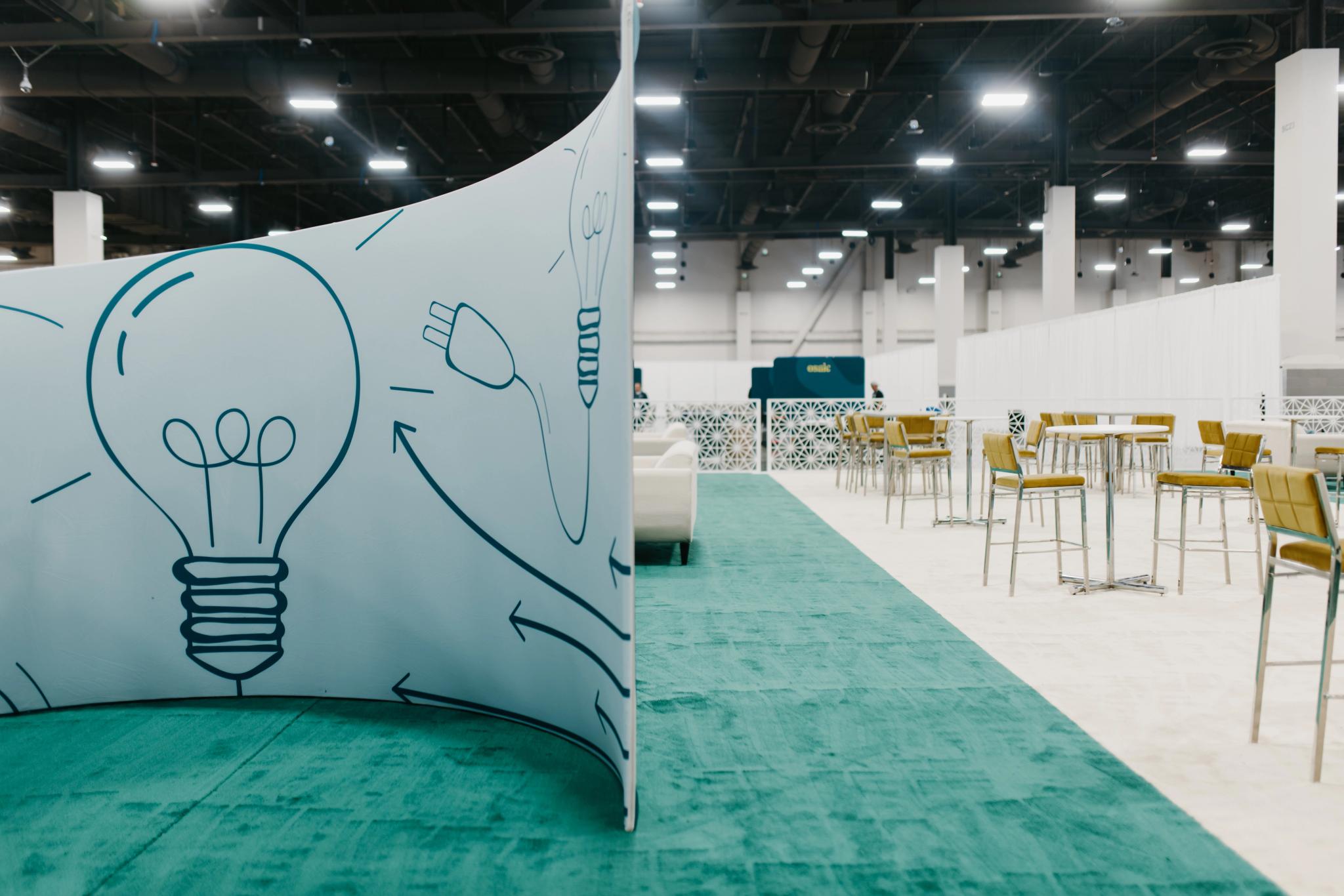 Light bulb illustration decorates a bright, modern office