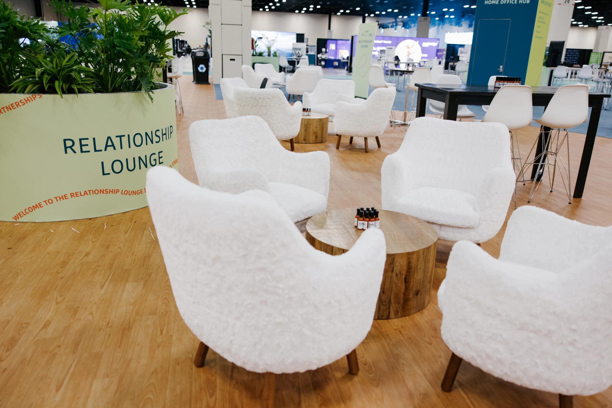 Chairs gathered around a table in modern, open space