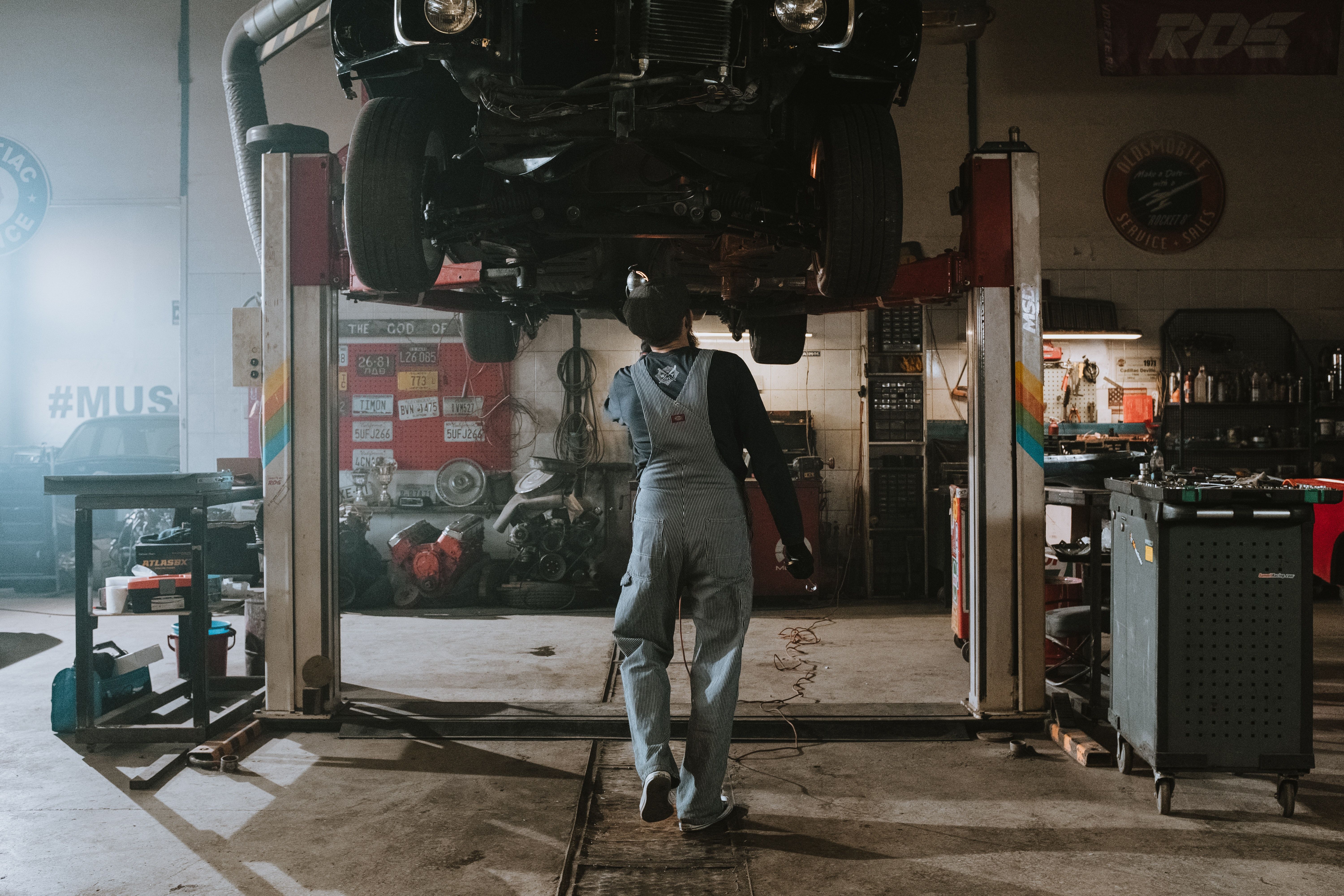 Repairman Fixing Damaged Vehicle