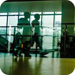 Colleagues talking in an office lobby