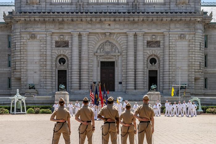Midshipmen in noon formation outside Bancroft Hall at the Naval Academy.