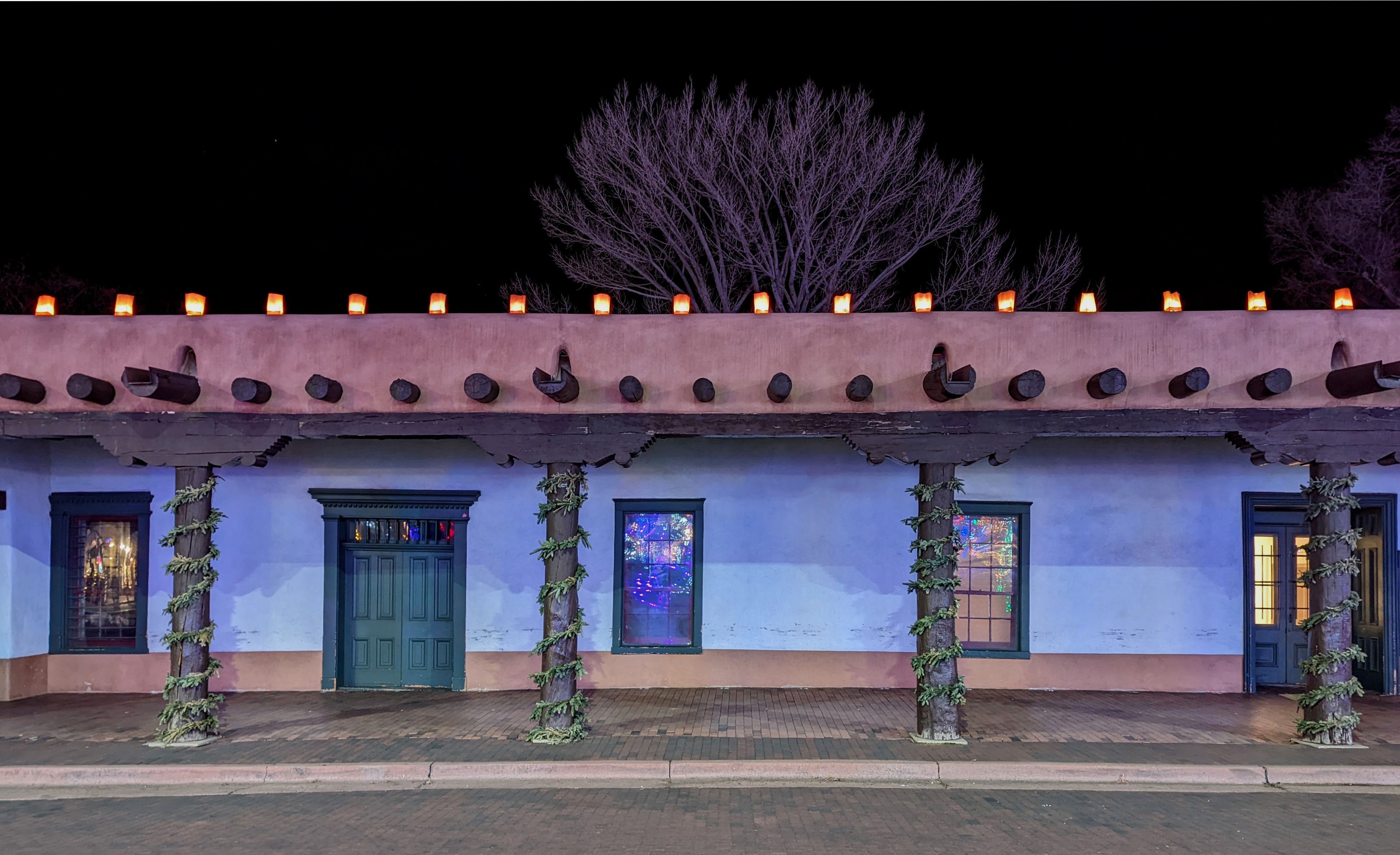 The Palace of the Governors illuminated at night in Santa Fe.