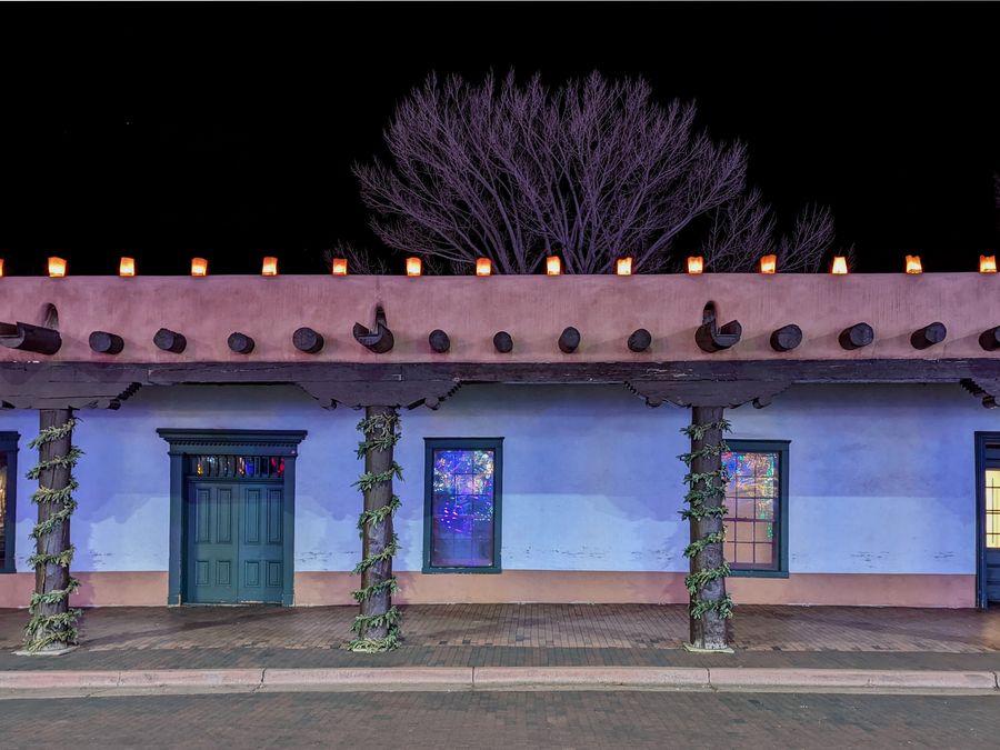 The Palace of the Governors illuminated at night in Santa Fe.